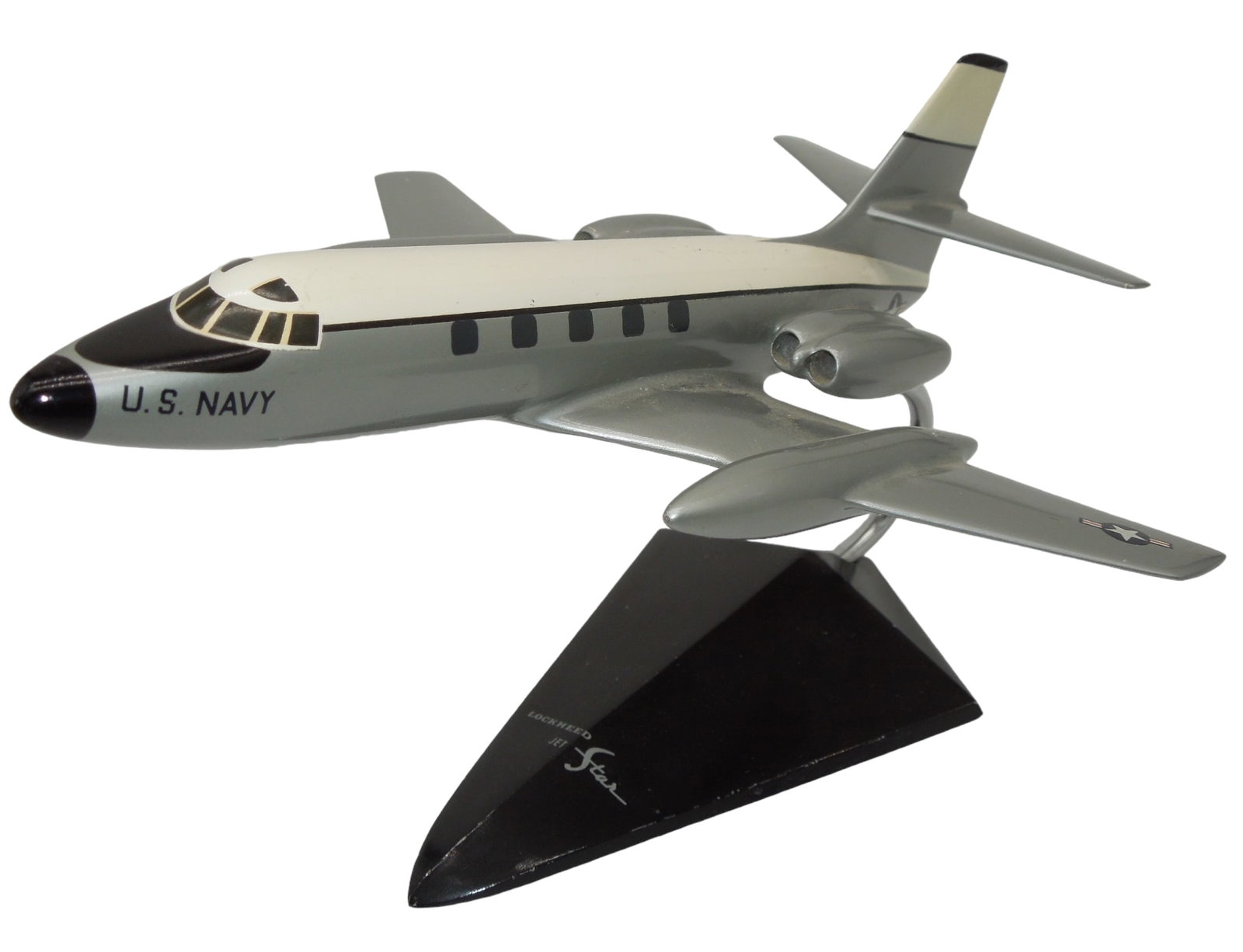 USN Navy Lockheed C-140 JetStar Aircraft & Display: USN Navy Lockheed C-140 JetStar Aircraft & Display. Metal piece. Approximate size is 8.25 inches. Good condition for its age.