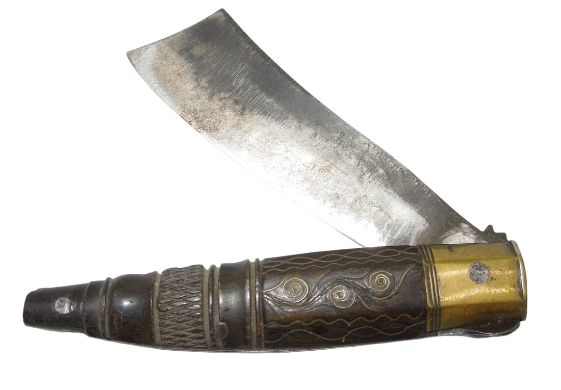 Ornately Carved Unique Asian Or African Pocket Knife: Unique pocket knife with a hand carved handle. When opened it has an older mechanism to keep it locked in place.