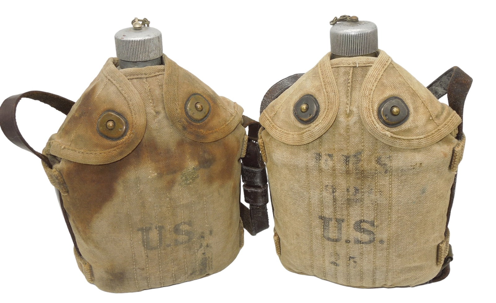 Lot (2) WWI US Army Mounted Cavalry Canteens #1: WWI Era metal canteens and mounted covers with leather hanger straps for horse cavalry use. Good condition showing wear consistent with age.