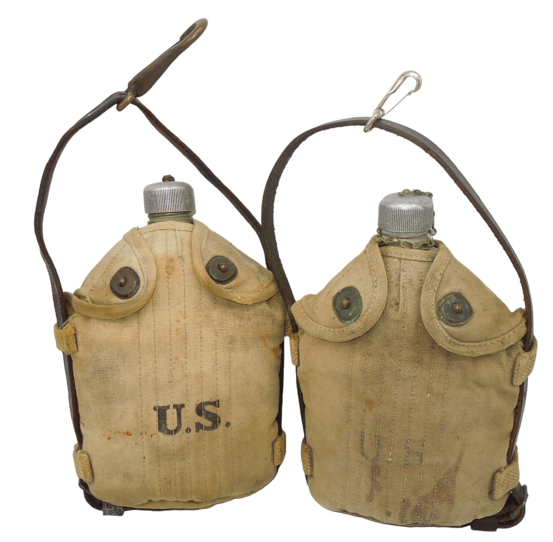 Lot (2) WWI US Army Mounted Cavalry Canteens #2: WWI Era metal canteens and mounted covers with leather hanger straps for horse cavalry use. Good condition showing wear consistent with age.