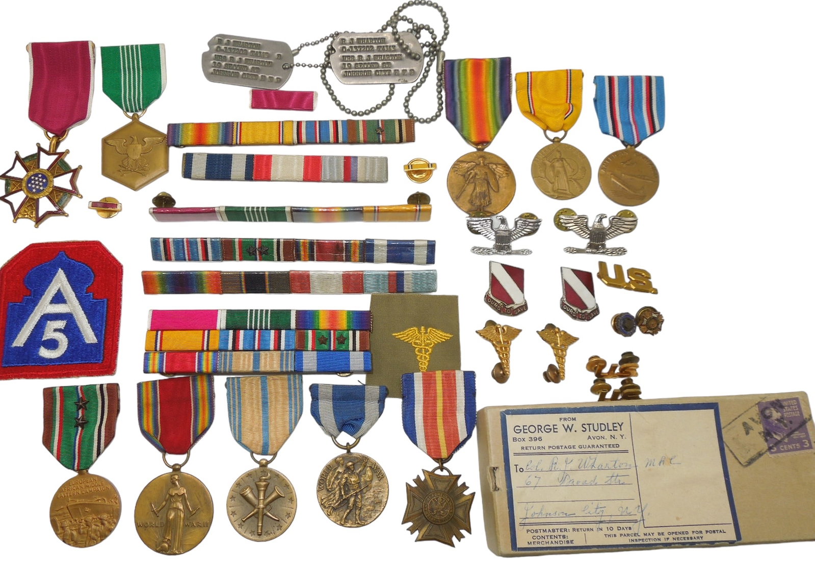WWI - WWII US Army Medical Colonel Legion of Merit Medal & Dog Tags Group: WWI - WWII US Army Medical Colonel Legion of Merit Medal & Dog Tags Group. Group named to Army Medical Corps Colonel Raeburn Wharton. Wharton served during WWI & WWII and saw overseas duty in Africa a