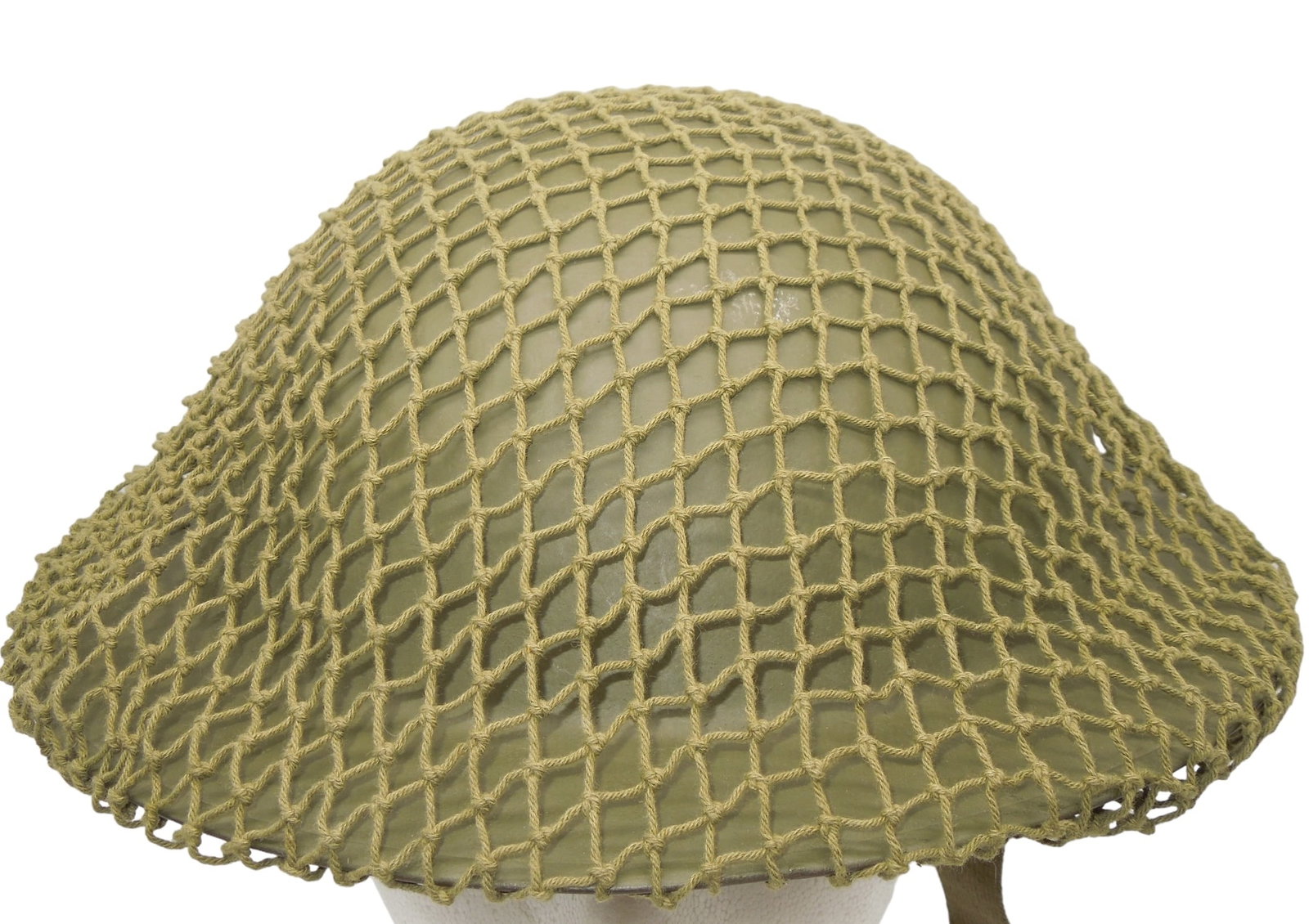 WWII British or Canadian MK Helmet With Camo Net: Original helmet, liner, and chinstrap from WWII. No dates or markings that we could find inside. Good condition showing wear consistent with age. The net is very loose and would need tightening for di