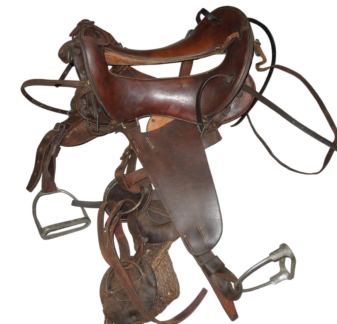 WWI-WWII US Army Horse Cavalry Leather Saddle Set: WWI-WWII US Army Horse Cavalry Leather Saddle Set. 12 inch seat. Stirrups are present and are marked RIA (Rock Island Arsenal) US NS 1918. All leather straps are intact. No maker can be seen on the ac