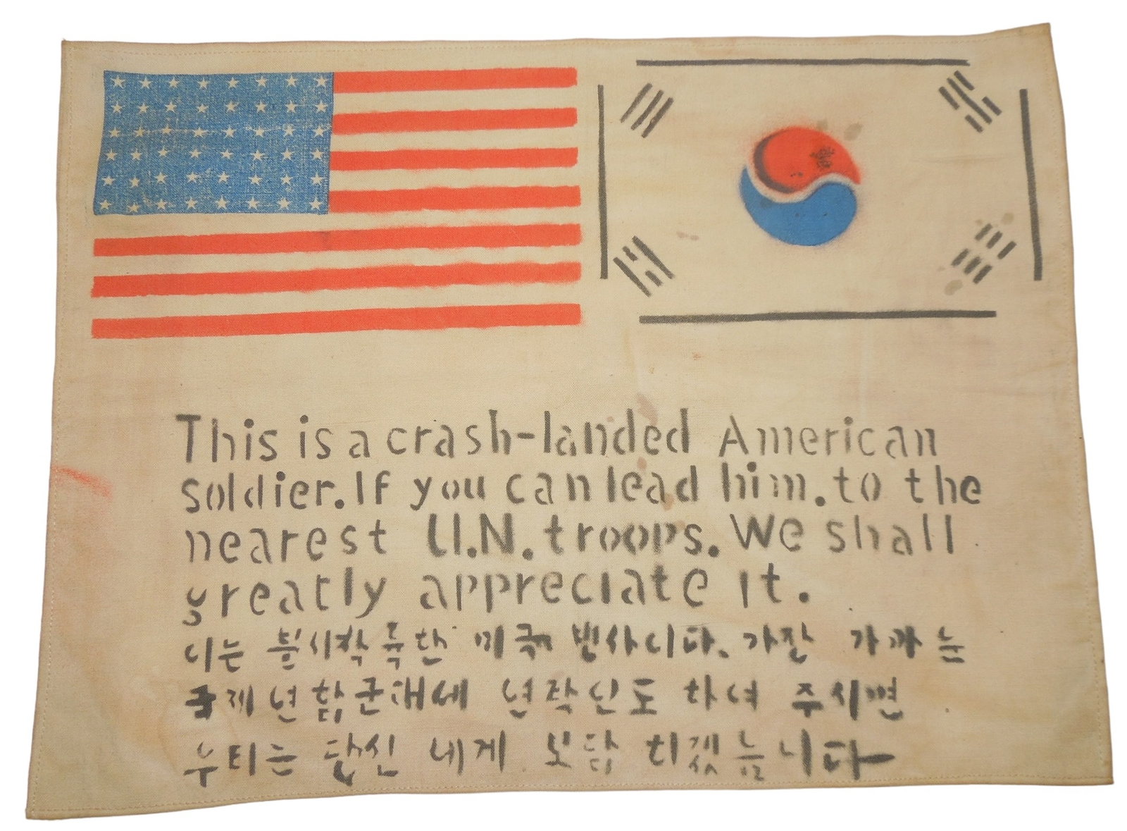 Korean War South Korea US Military Theater Made Cloth Blood Chit: Original cloth fabric piece designed to be sewn into aviator jackets during the Korean War, with stamped wording to assist them in case of emergency. Good condition with soiling consistent with age.