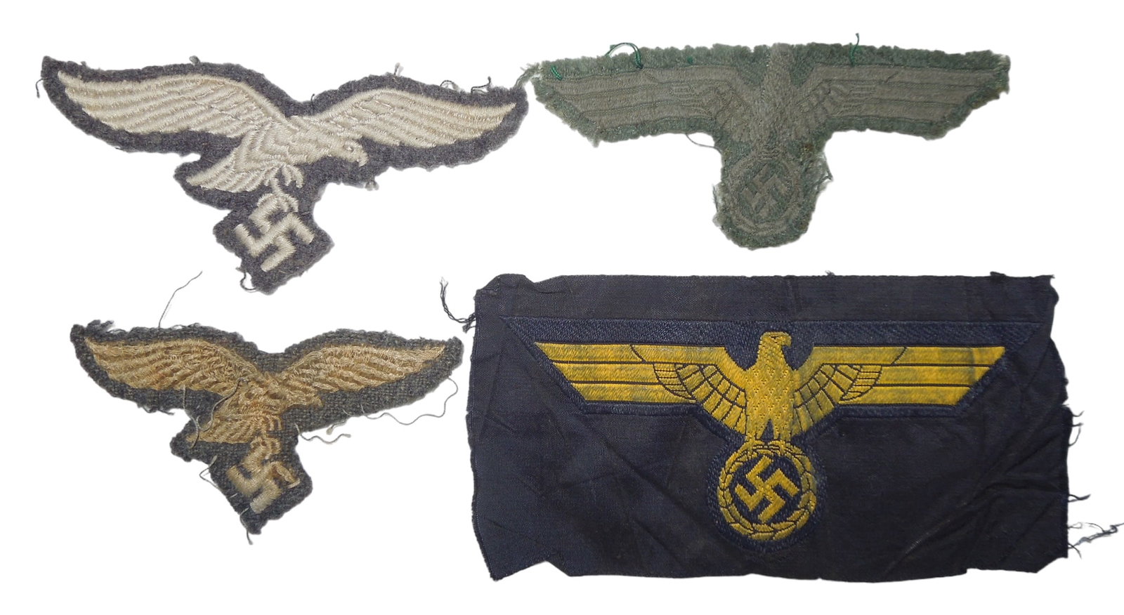 Lot (4) WWII German Luftwaffe, Heer, & Kriegsmarine Breast Eagle Patches: Original WWII German as shown. See photos for condition.