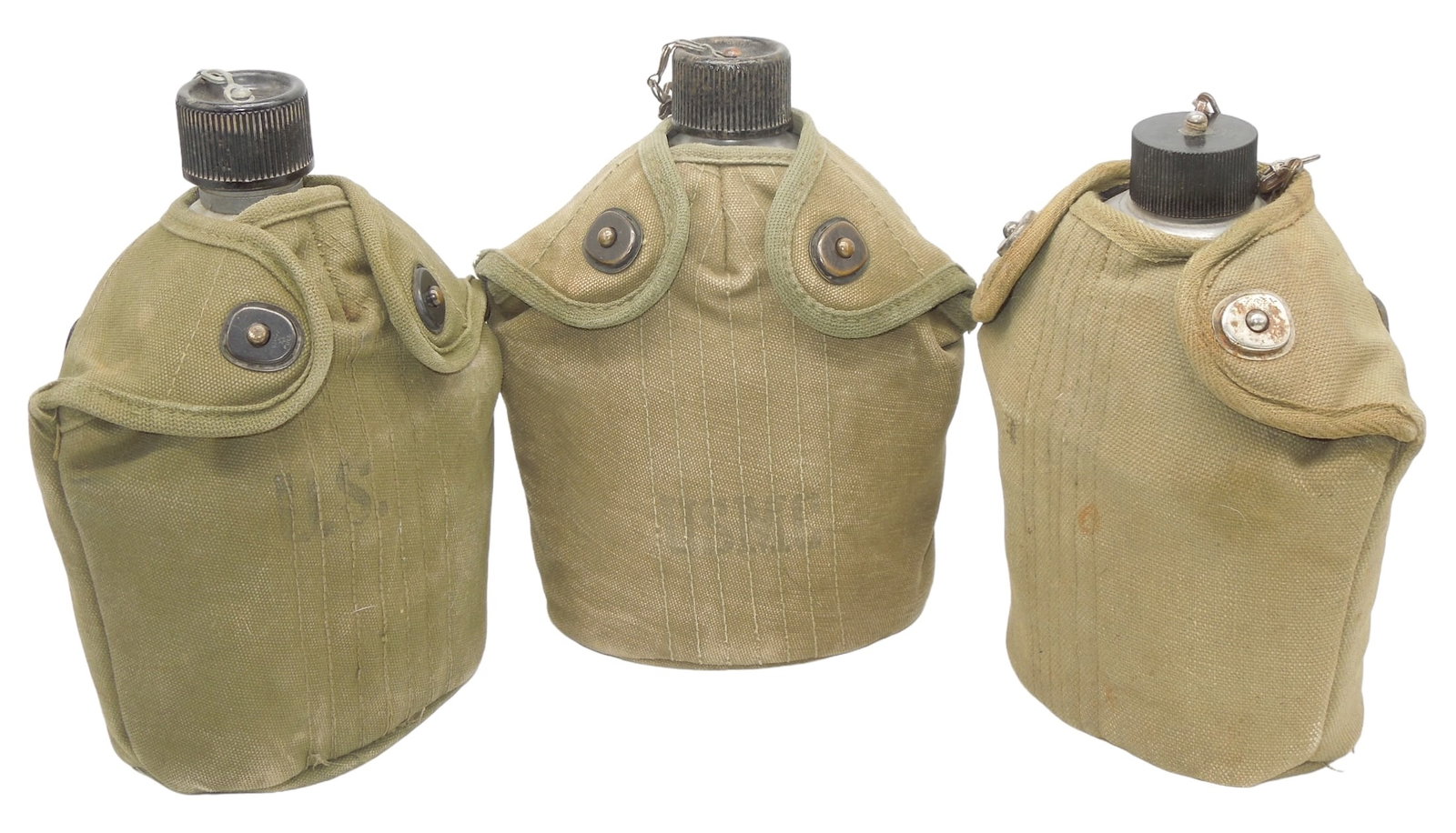 Lot (3) WWI - WWII US Canteens & Korean War Covers USMC & Army: WWII US Canteens & Korean War Covers USMC & Army. Lot of (3). The maker marks seen on these pieces are the following: Canteen 1944 S.M Co & Cup 1941 T.A.C.U. Co., US 1918 L.F. & C, 1943 G. R. & R. Co.
