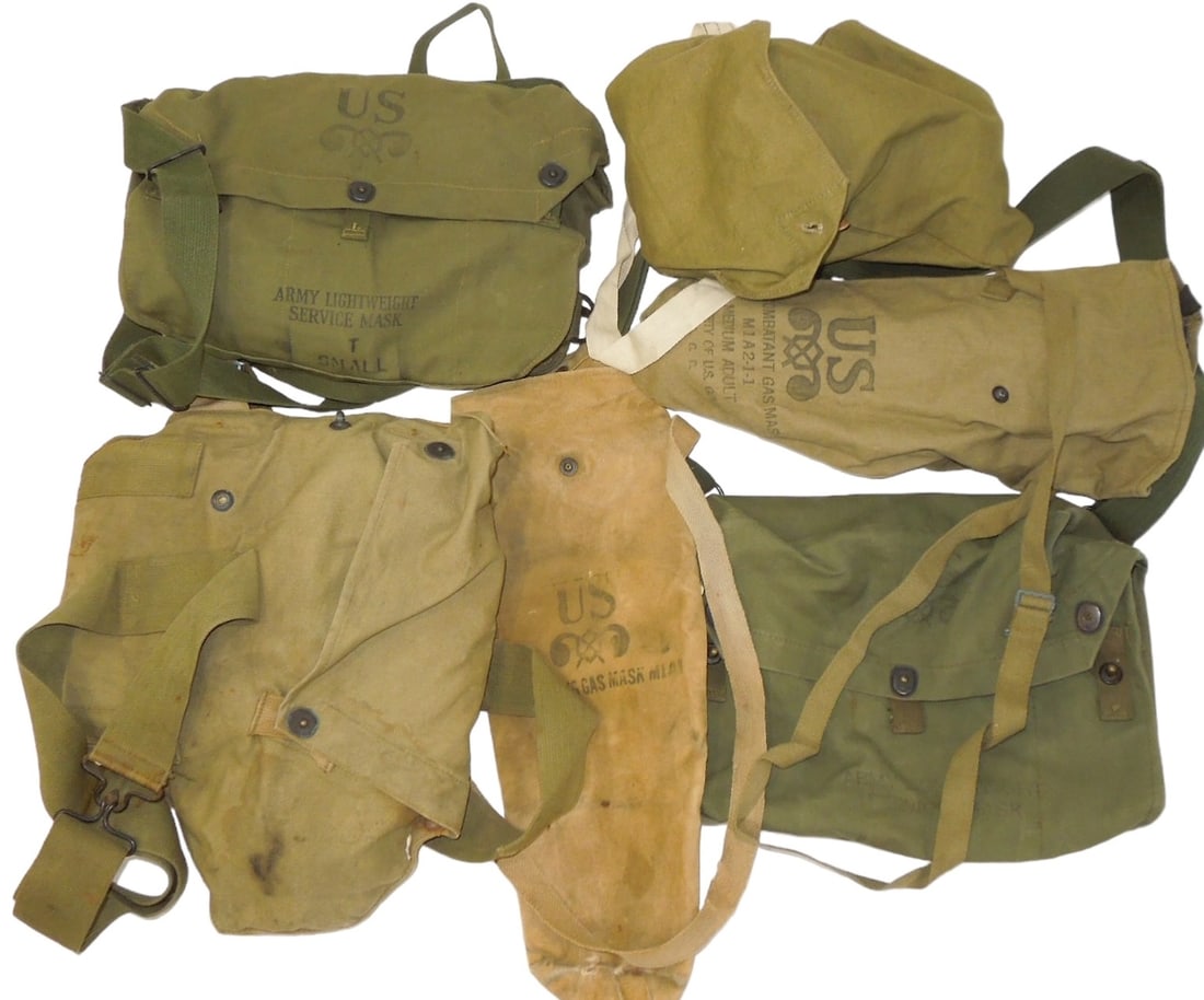WWII US & British Military Gas Masks & Bags: Lot of gas masks and empty gas mask bags to include Army Lightweight and Diaphragm style gas masks and bags, a British civilian version, US civil defense, and two extra bags. Unknown if any of the mas