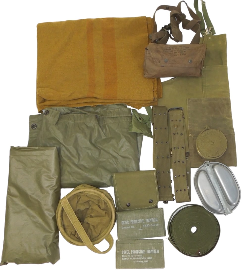 WWI - Vietnam War Field Gear Blanket Ponchos Belts Life Jacket Water Bucket: Lot of field gear to include a US WWI wool blanket, Korean War aviators life preserver in bag, two WWII chemical protective covers, a water bucket, two web pistol belts, two Vietnam era rain ponchos, 