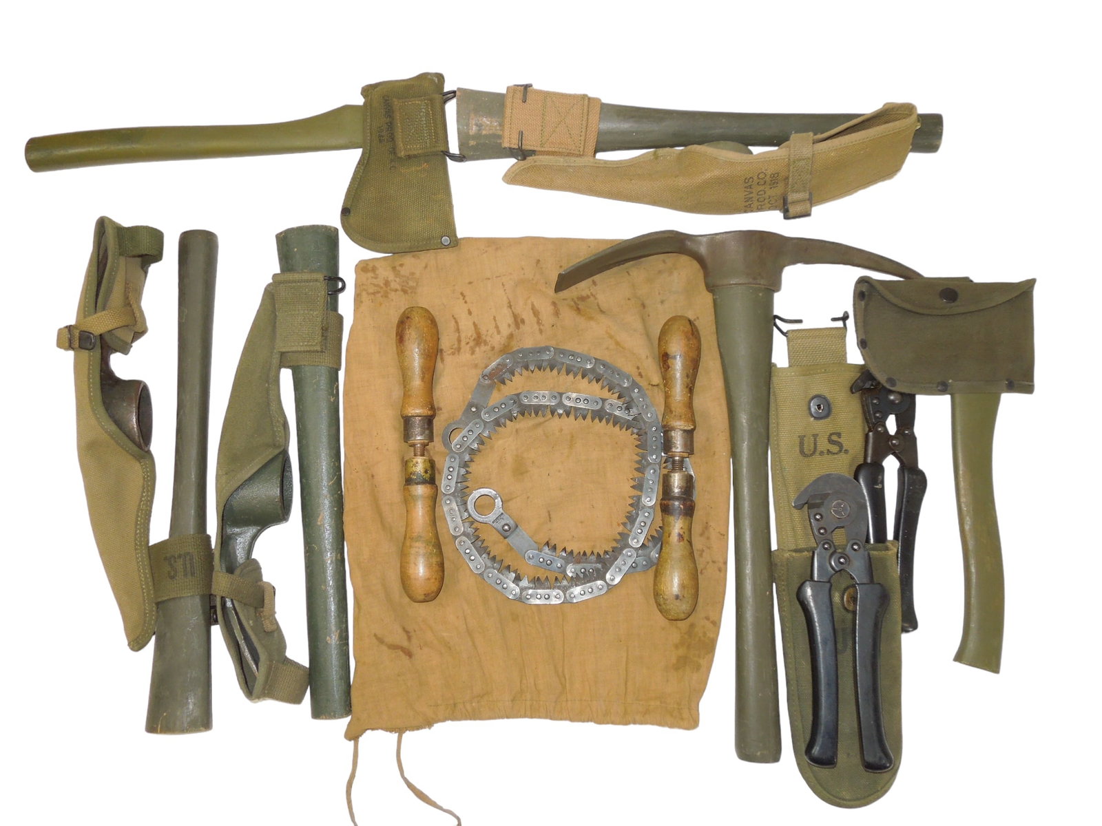 WWII US Military Pick Mattocks, Hatchets Field Wire Cutters & Hand Saw: WWII US Military Pick Mattocks, Hatchets, Wire Cutters & Hand Saw. Lot of (9). Some pieces are marked US along with some of the following: Ax 1945 Plumb, Wire Cutter US -5000 Volts Max, 1944 Wire Cutt