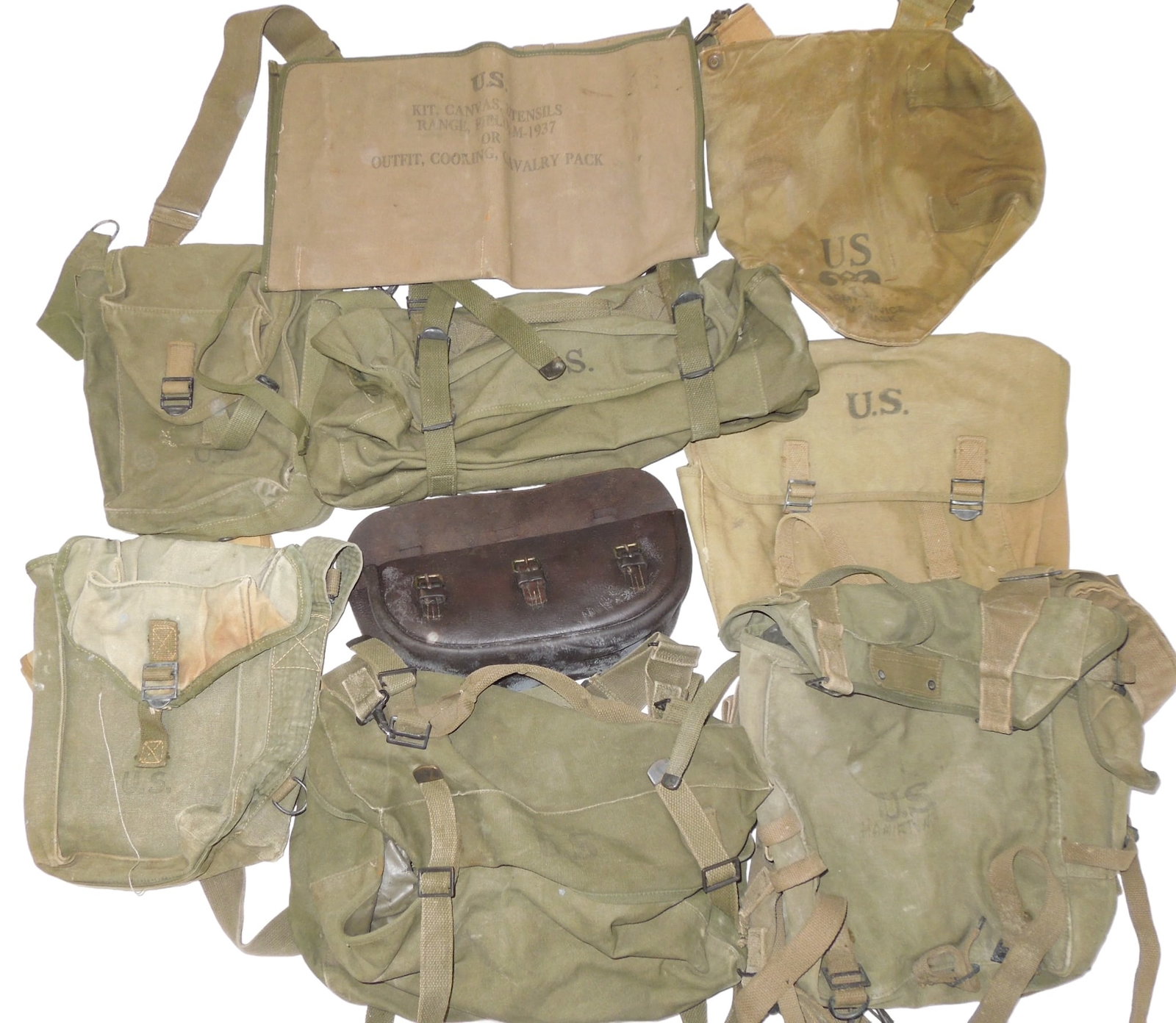WWII - Korean War US Military Bags & Pouches M1937 Cavalry Pack Musette: Lot of bags to include M1936 Cooking Cavalry utensil pouch, diaphragm gas mask bag (poor, stained condition), various ammo bags, WWII musette bag marked for the Transportation Officer of the New York 