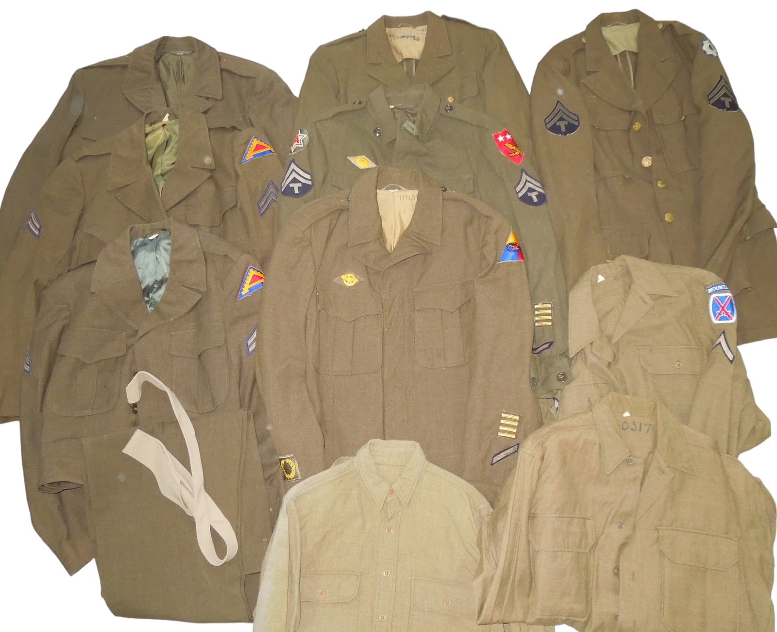 WWII - Korean War US Army Uniforms 10th Mountain USMC Armored Shirts Pants: Large lot of WWII - 1950s uniforms including 10th Mountain Division patched Private First Class shirt, a 3rd Amphibious Command and Sixth US Army patched Ike jacket, Armored Ike jacket, Service Comman