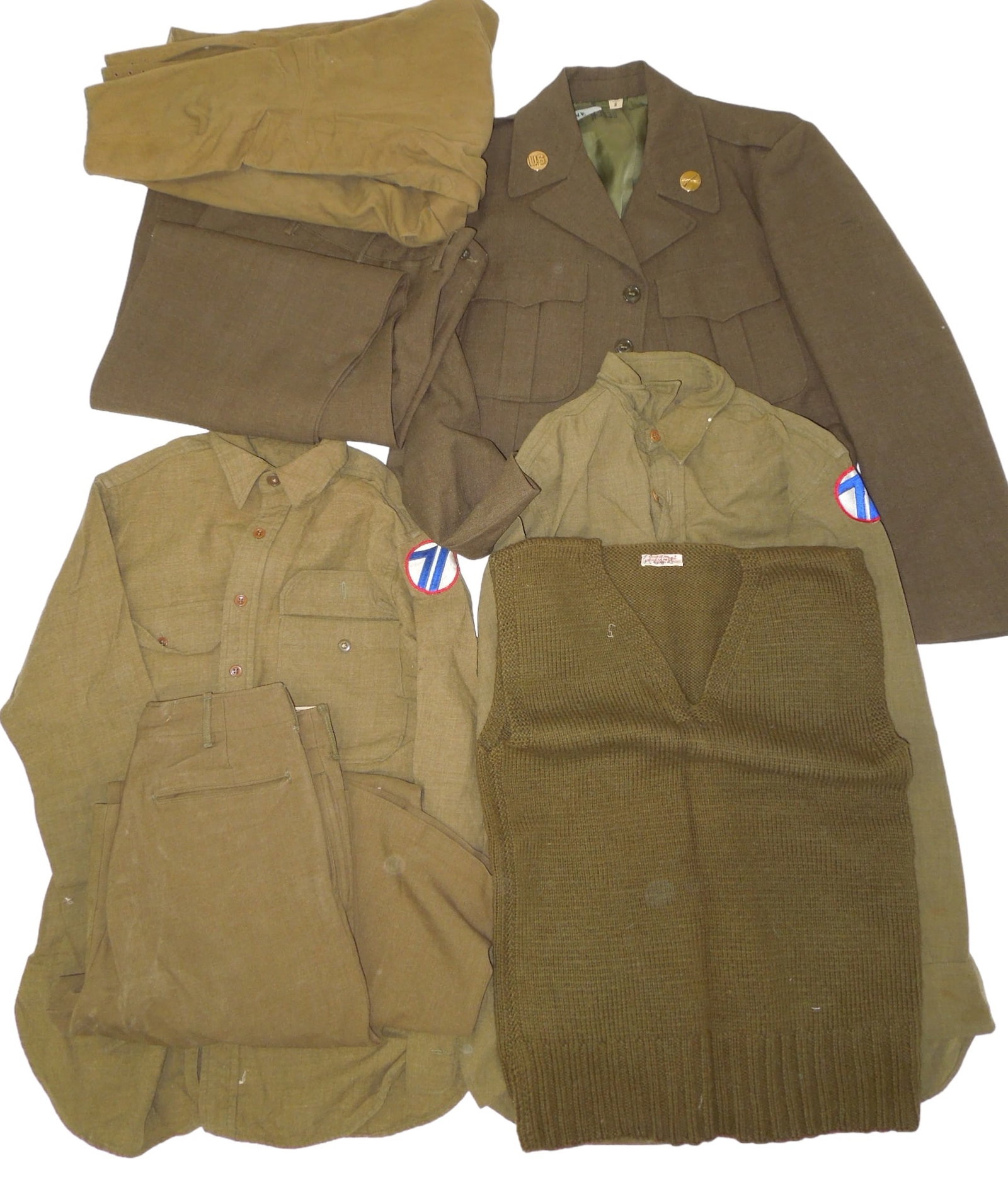 WWII Uniforms US Army 71st Division Shirts Sweater Pants Ike Jacket: Lot of WWII uniform items to include an Ike jacket with collar discs, two 71st Infantry Division patched shirts, a wool sweater, and three pairs of pants. Fair to Good condition showing wear consisten
