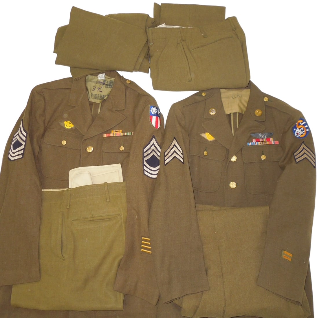 WWII Uniforms China Burma India CBI & 5th Air Force With Wings: Lot of two WWII uniform jackets and four pants to include China Burma India Master Sergeant patched jacket with ribbon bars showing Pacific and European Theater service, and a nice 5th Air Force Serge