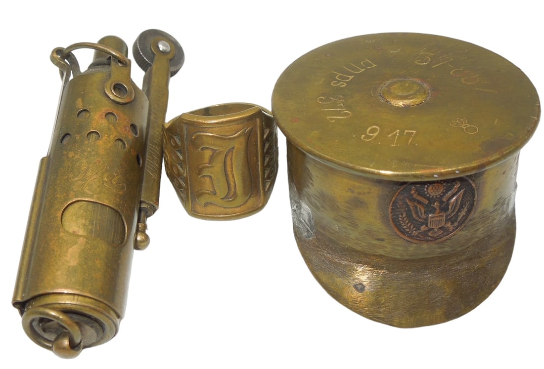 WWI US Military Trench Art Pieces Artillery Shell Visor, Lighter & Ring: WWI US Military Trench Art Pieces Artillery Shell Visor, Lighter & Ring. The lighter is marked made in Austria. This piece does not spark. Interesting trench art pieces.