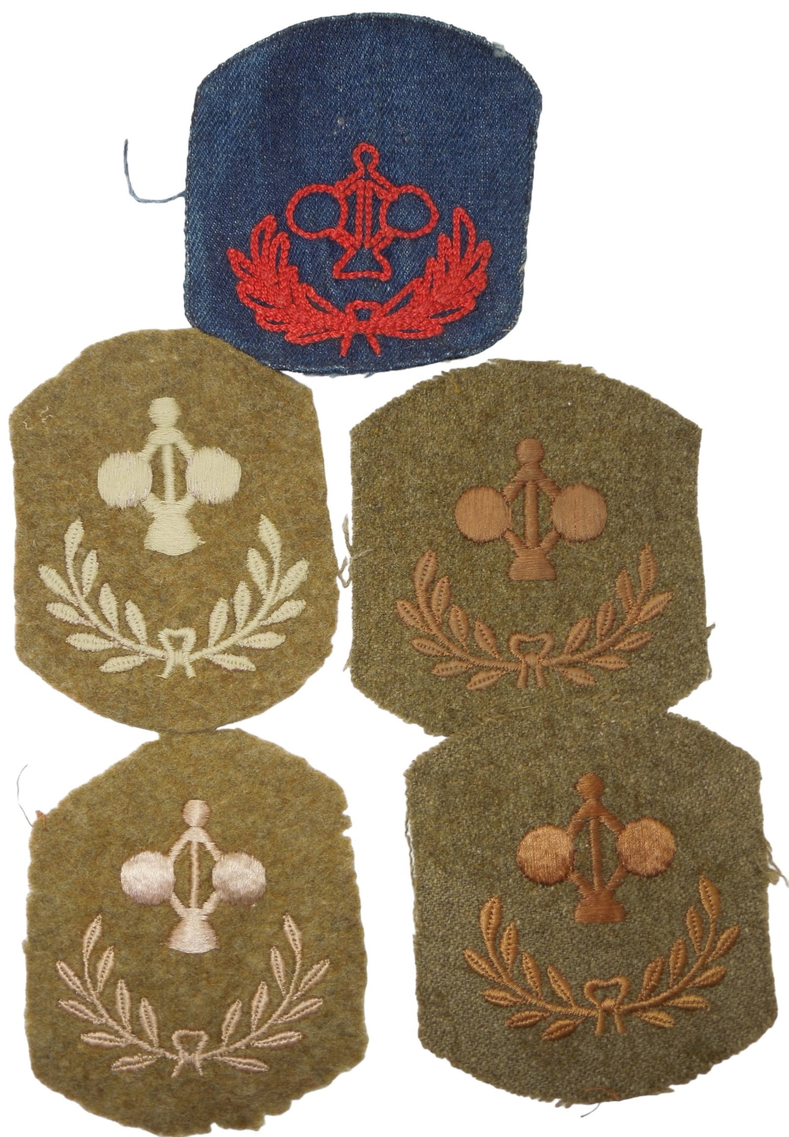 WWI US Army Coast Artillery Specialty Patches Including Denim Variation: Five WWI patches, with the highlight being a scarce denim on red version. Good condition showing wear consistent with age.