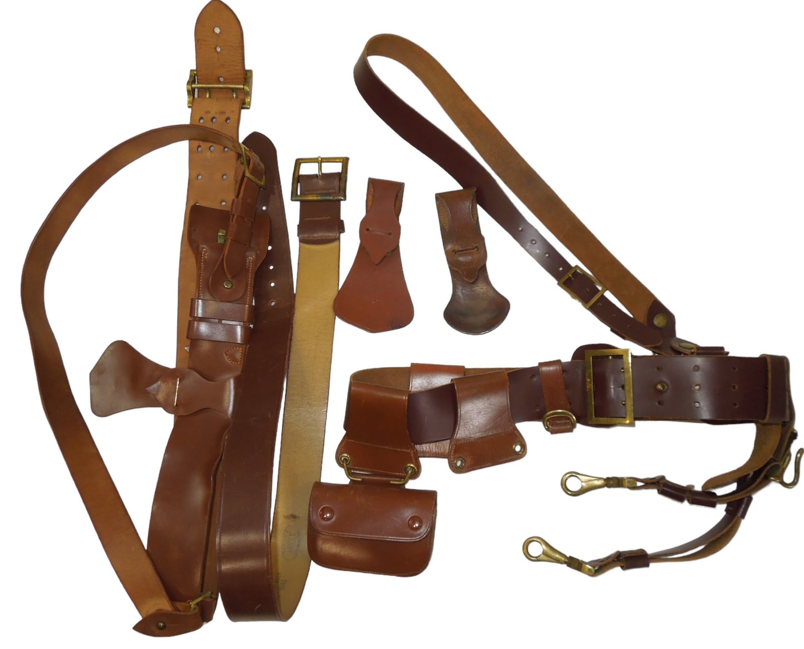 WWII US Army Sam Browne Style Officer Uniform Belts: Lot of cordovan and leather type Officer belts circa 1930s to early 1940s for US Army and Army Air Force Officers, Various accessories and pouches included. Good condition showing wear consistent with