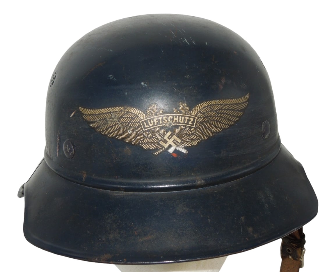 WWII German WWII Luftschutz Helmet & Decal: Oriignal WWII era Size 56 marked Luftshutz helemt, liner, and decals. The shinstrap is broken in one place. Fair to Good condition showing wear consistent with age.