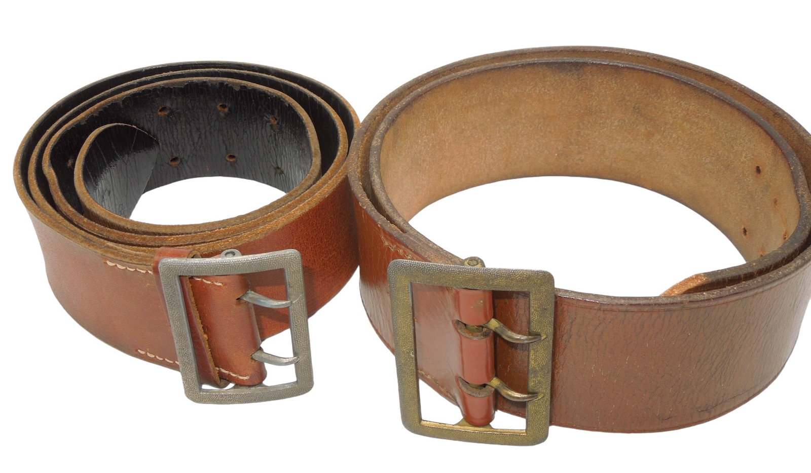 Lot (2) WWII German Wehrmacht Tan Uniform Belts: Lot of two original WWII German khaki leather belts with sand pebbled type buckles. Believed to possibly be for khaki political or SA uniforms. Good condition showing wear consistent with age.