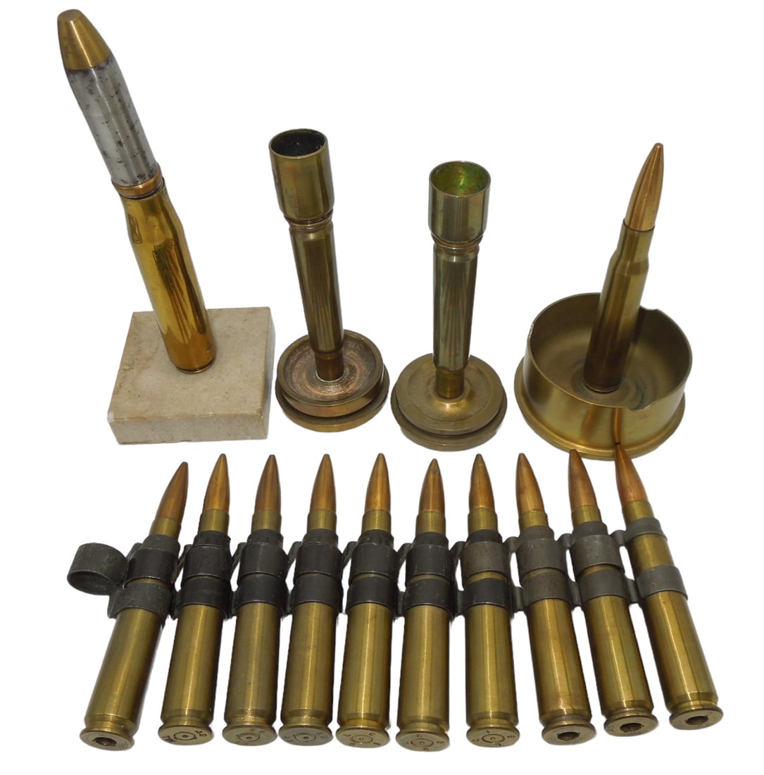 WWII - Vietnam Inert .50 Caliber Trench Art & Display Pieces: .50 Caliber linked rounds (mix of WWII - post war), trench art candle holders and ashtray and a 20mm desk ornament. Fair to good condition showing wear consistent with age. US shipping only.