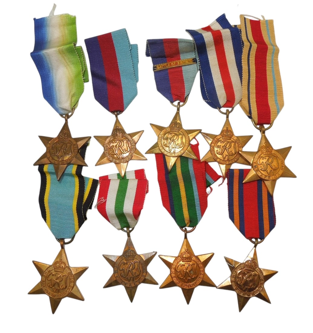 Lot (9) WWII British Military Star Medals Europe Pacific: Large lot of original WWII era medals, none named, including the Italy Star, Aircrew Europe, Atlantic Star, 1939-45 Star, Burma Star, Africa Star, Pacific Star, and France & Germany Star.