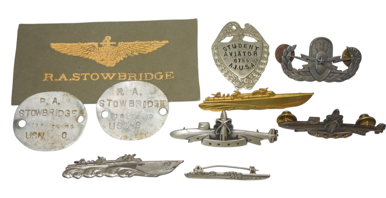 Lot WWII US Navy & Army Badges Dog Tags Aviator Kennedy: Large lot of insignia as shown. The aviator badge is missing the pin, the dog tags are crudely made, and some of the others are marked on the backs.