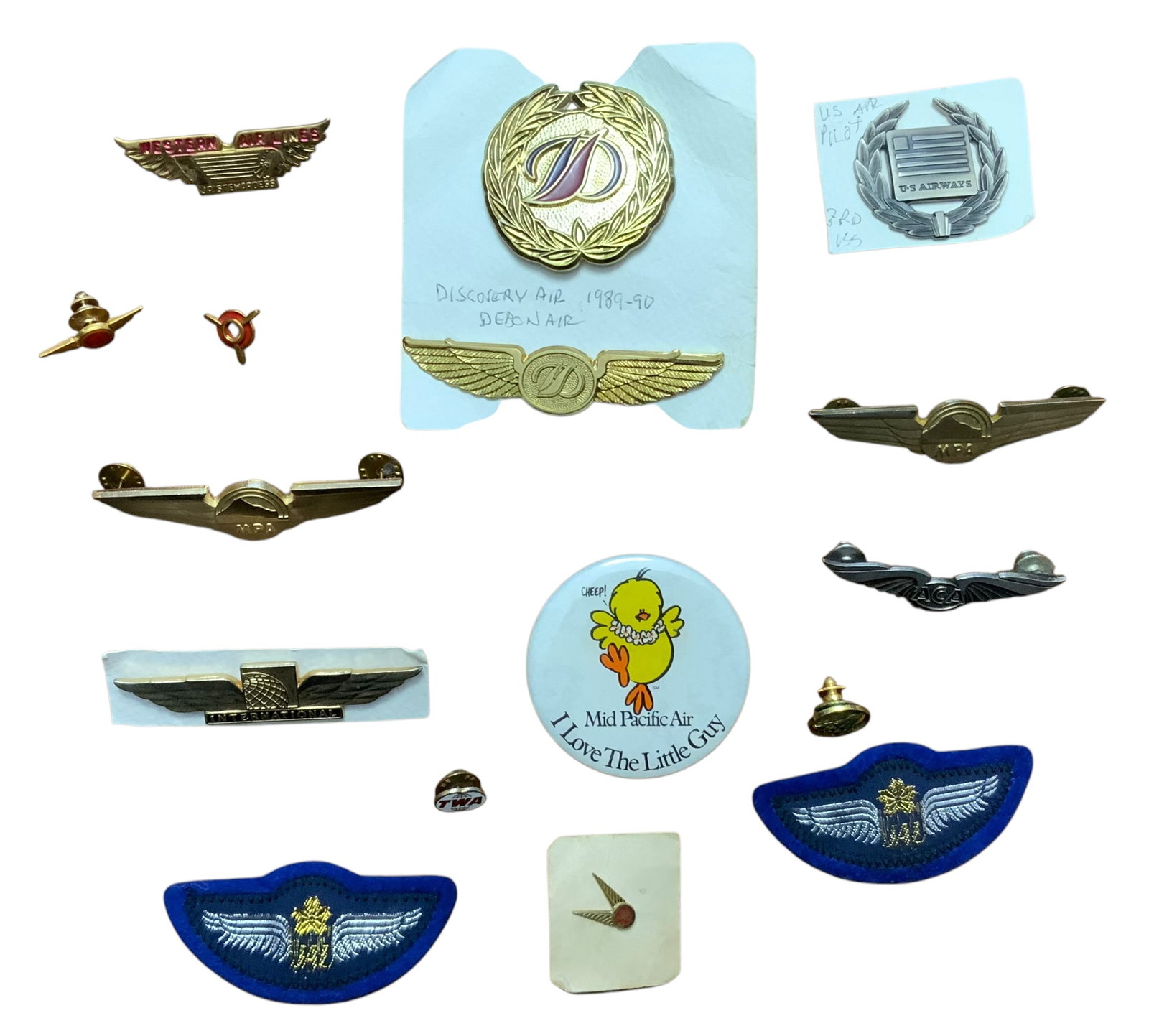 Various Airlines Wing & Insignia Lot Western, ACA, MPA, TWA, Weaver, Etc.: Various Airlines Wing & Insignia Western, ACA, MPA, TWA, Weaver, Etc. Some pieces include: Western Airlines Junior Stewardess, Atlantic Coast Airlines ACA, Japan Airlines, Mid Pacific Air, US Airways 