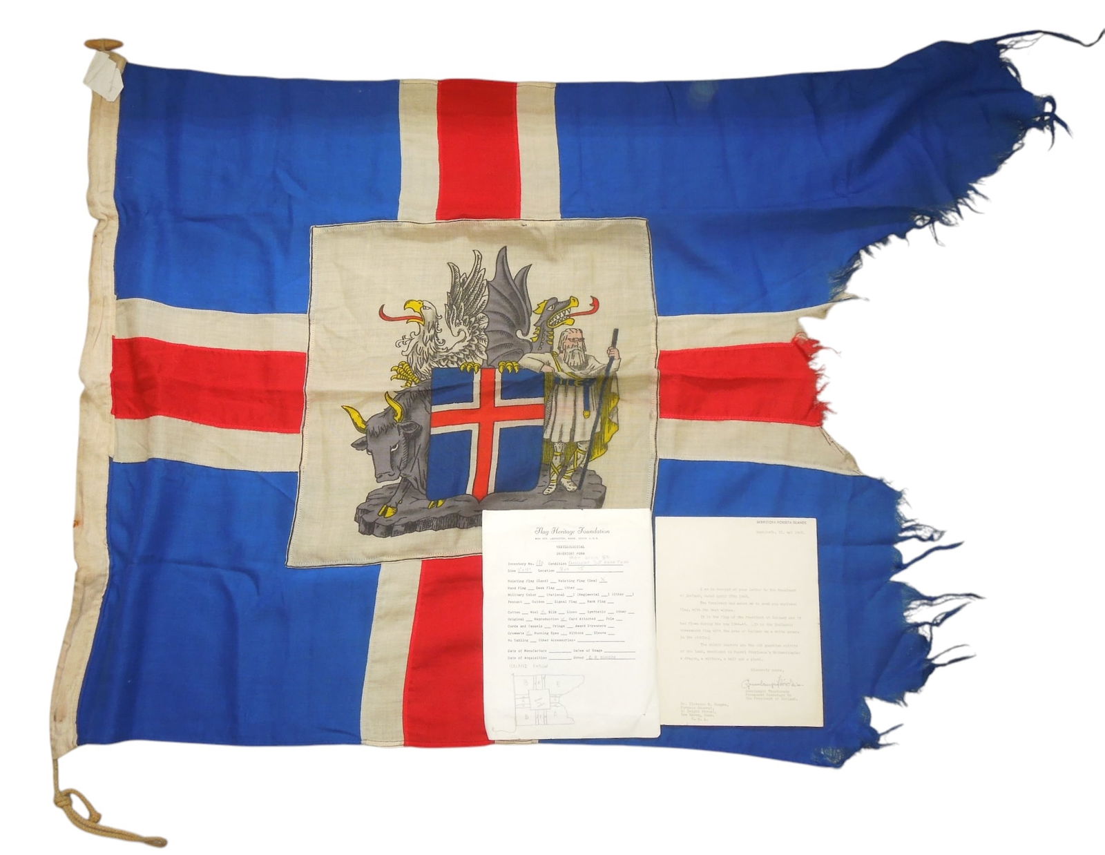WWII Flown Flag of Iceland With Letter: Original tattered flag and original dry mounted letter from the Icelandic Government noting that it was flown during wartime, and given to Dr. Clarence Rungee for his museum
