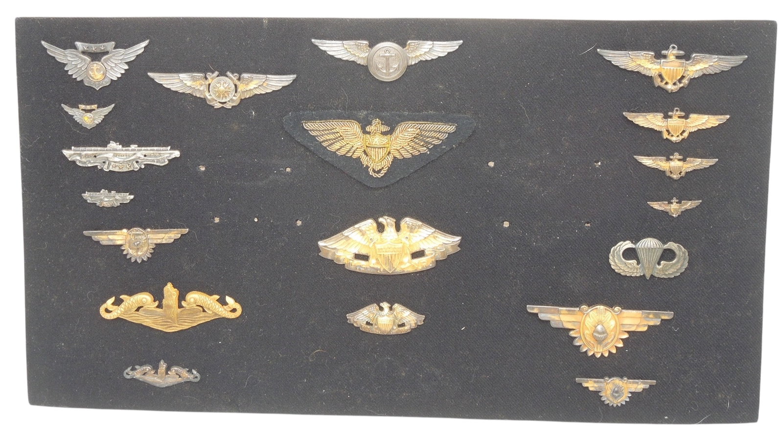 WWII US Navy Salesman Board of Wings Badges Sterling: Original Sales board of WWII - 50s era wings and insignia as shown, all removable with a handwritten reference chart. Many are sterling.