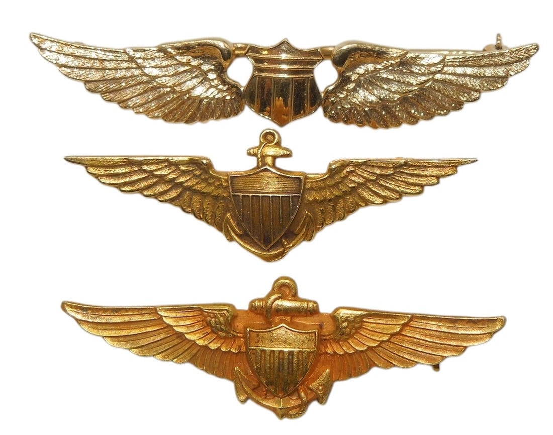 Lot (3) WWI - WWII US Navy 14K-18K Gold Aviator Wings: Three original wings- Sweetheart style wing marked 14K on the roller catch weighing 4 grams, WWI mini wing marked 14K weighing 2.3 grams, and a 10K mini Aviator wing weighing 2.7 grams.