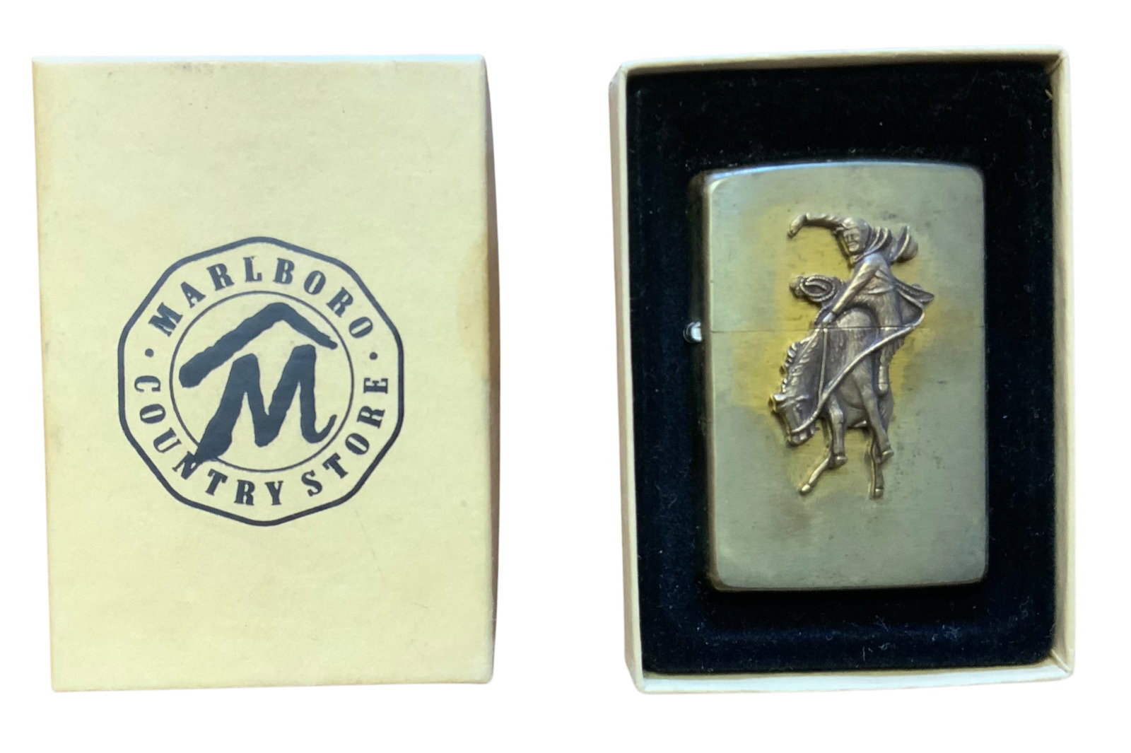 1994 Zippo Lighter Marlboro Country Store Cigarettes: 1994 Zippo Lighter Marlboro Country Store Cigarettes. This is a new lighter. We have not tested it to see if it is functional. The brass lighter appears to be tarnished. See photos for a better descri