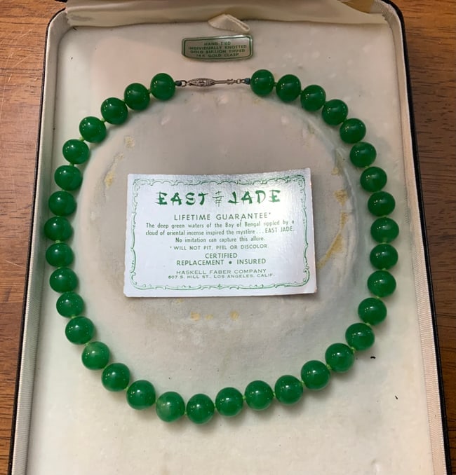1960s Miriam Haskell Far East Jade 14KG Clasp Necklace: Miriam Haskell Far East Jade Necklace from the 1960s stands out with a 14K gold clasp and 35 individually knotted jade beads. This genuine glowing green JADE beaded necklace measures 15 inches. The ne