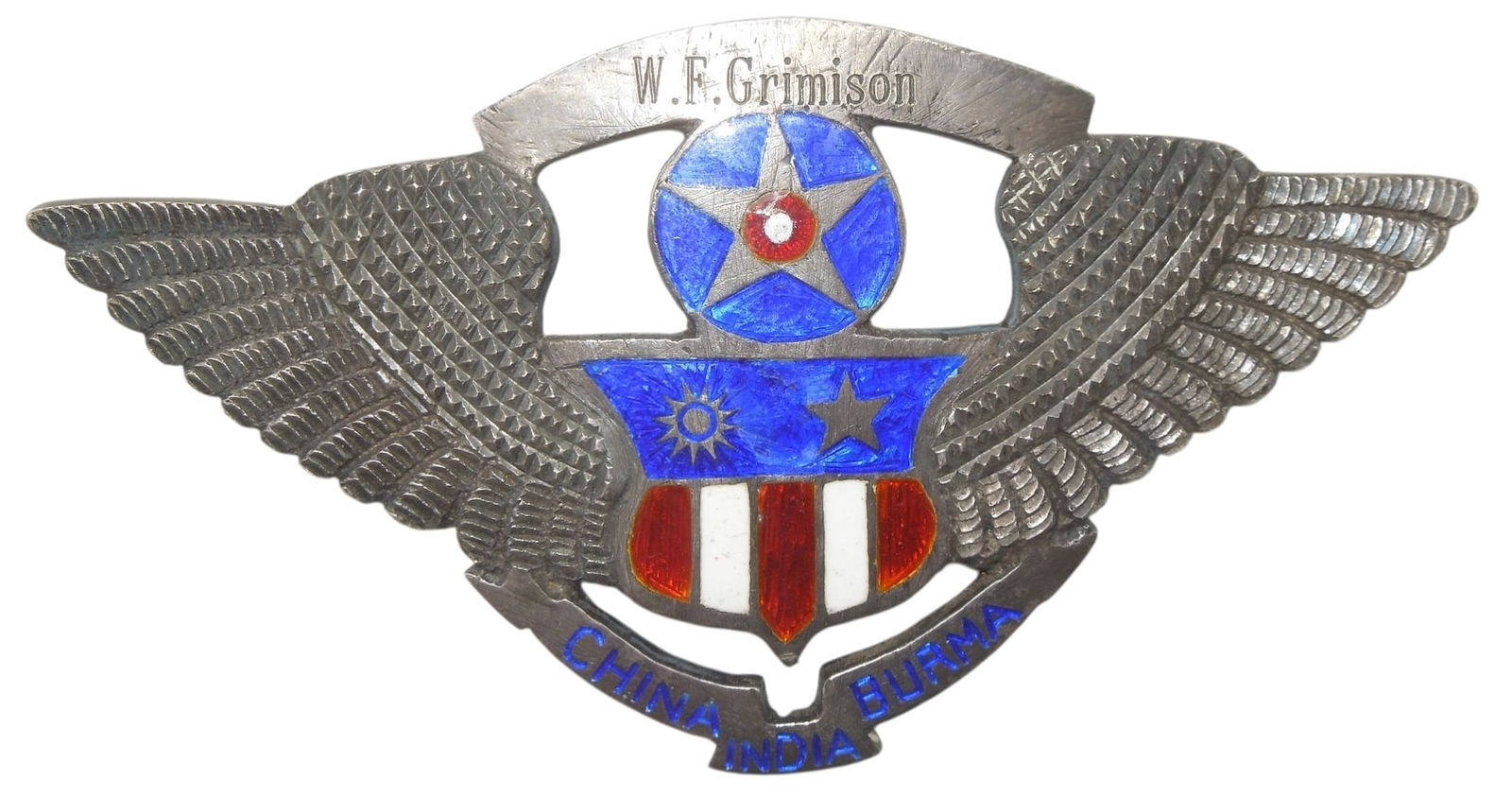 WWII US Army China Burma India CBI Silver 74 Grams Engraved Cap Hat Badge: Original as shown. Engraved to W.F. Grimison, this unmarked but acid tested silver piece weighs in at 74.43 grams (including the screw nut)