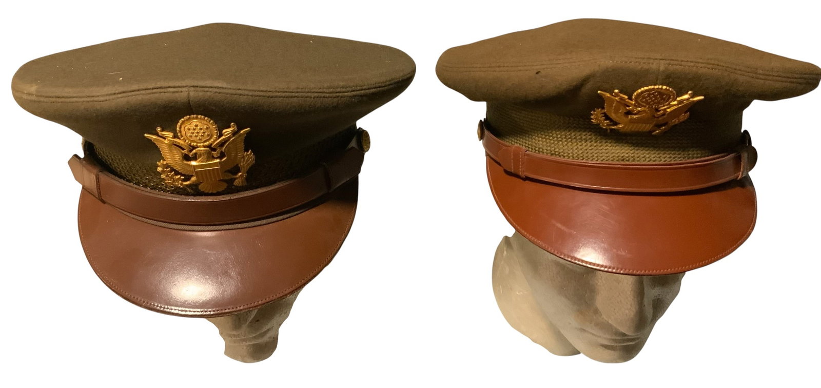 WWII Era Army Officer Visor Caps LOT (2) Bancroft & Nudelman: WWII Era Army Officer Visor Caps. LOT of (2) as shown. Sizes seen are 6 7/8 and 7 1/8. Makers: Bancroft and Miltairre Nudelman Brothers Uniforms. Overall, very good condition. The display heads do not