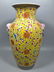 Famille rose painted vase with yellow glaze