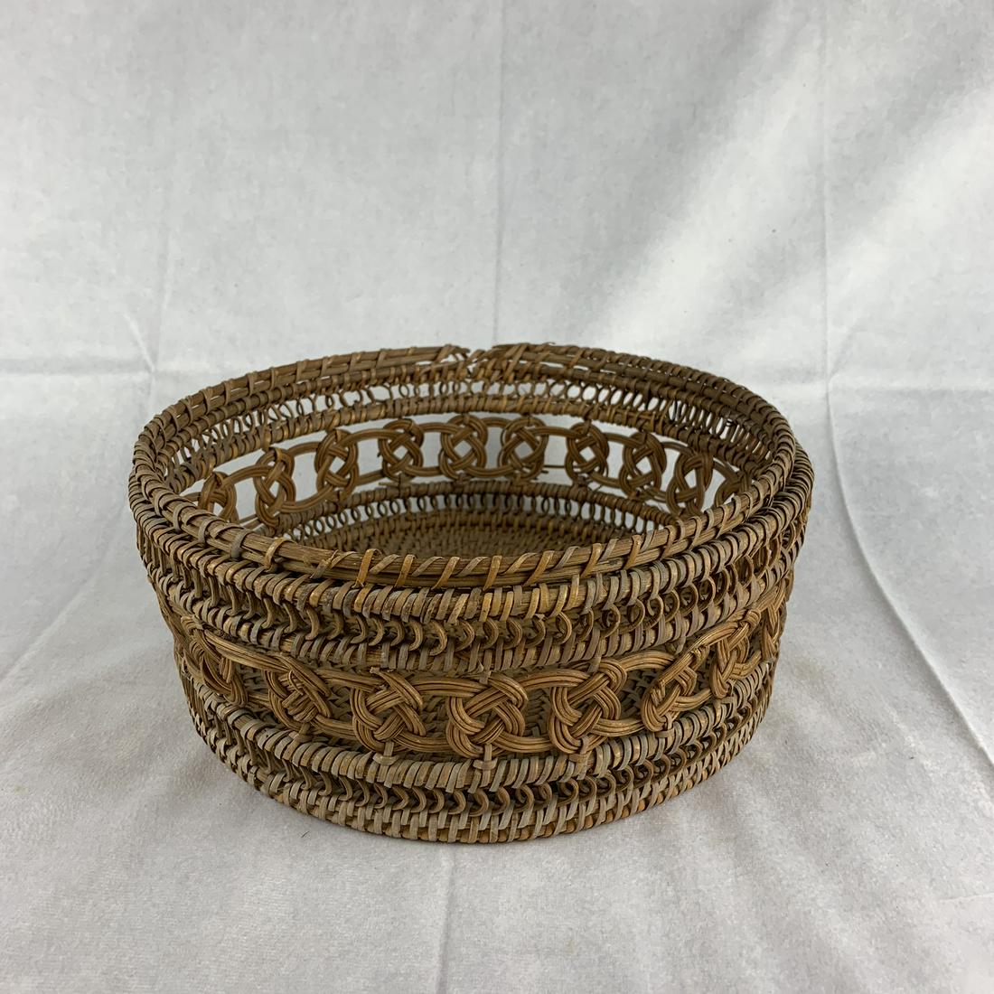 19 th Century Birch Root Woven Basket: 19 th century woven birch bark basket, fancy design. Very solid. Break at rim in one spot , otherwise good. 10” x 4”.