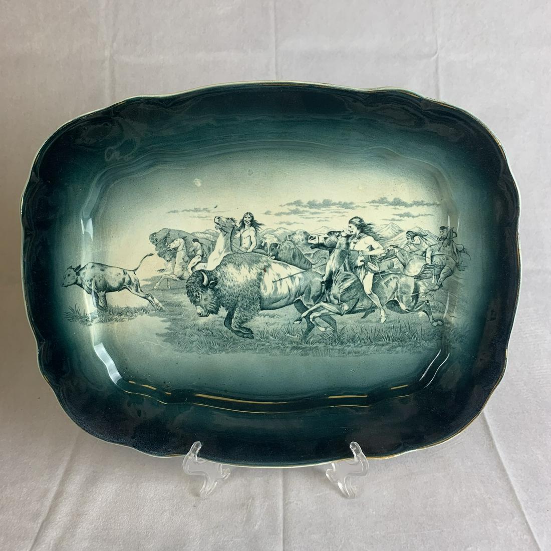 Large Antique Buffalo Pottery Platter: Very clean vintage Buffalo Pottery platter. Buffalo Hunt scene. 14 inches by 11 inches. Strong color to scene. NO damage. Well marked. Very slight staining on backside.