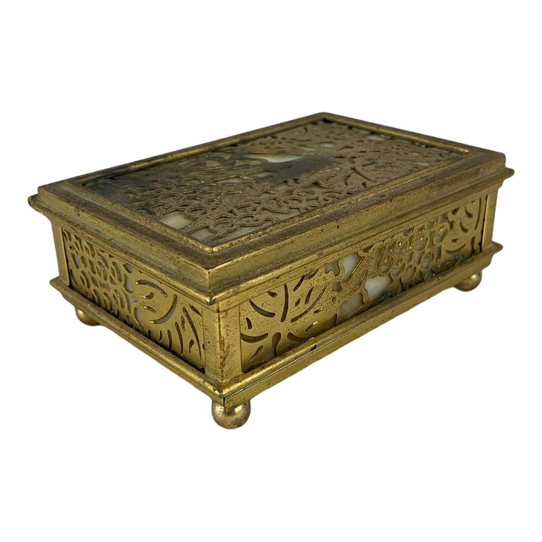 Tiffany Studios New York Grape vine Bronze and Slag: Another rare piece of original Tiffany Studios art. A grapevine pattern stamp box. 4 ¼” x 3”. Marked Tiffany Studios New York 800. NO breakage. Slight tarnishing on bronze.