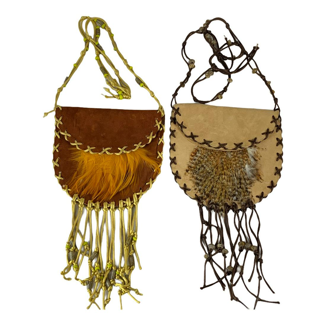 2 Leather Hide Designer Hand Bags: A pair of leather with fringe designer hand bage. All original and excellent. Each 8” x 7” without long fringe and straps.