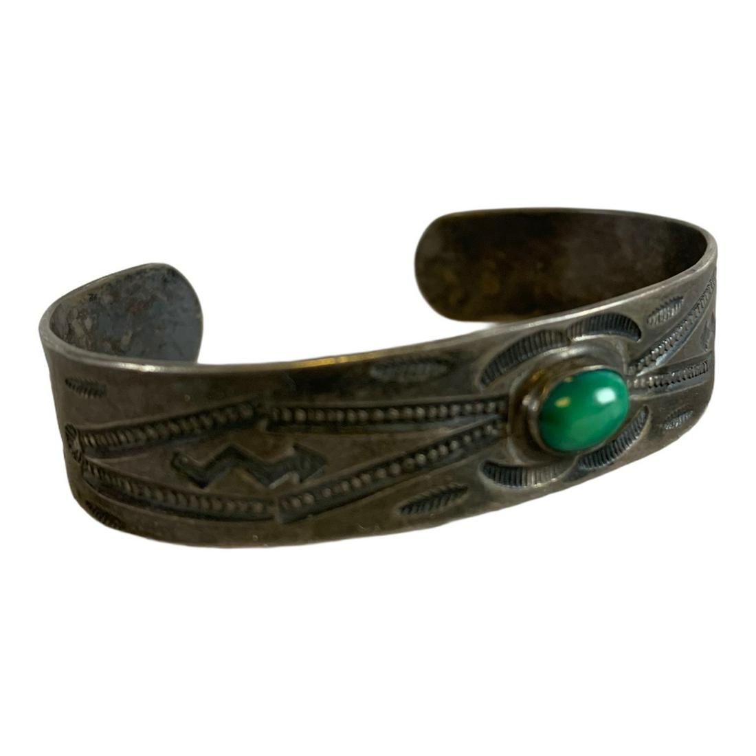 Old Pawn Vintage Fred Harvey Era Navajo Arrow & Snake: Navajo old pawn sterling silver turquoise bracelet. The bracelet measures approximately 1/2" wide and is stamped with a variety of early stamp designs highlighted with snakes & arrows with Zia's at th