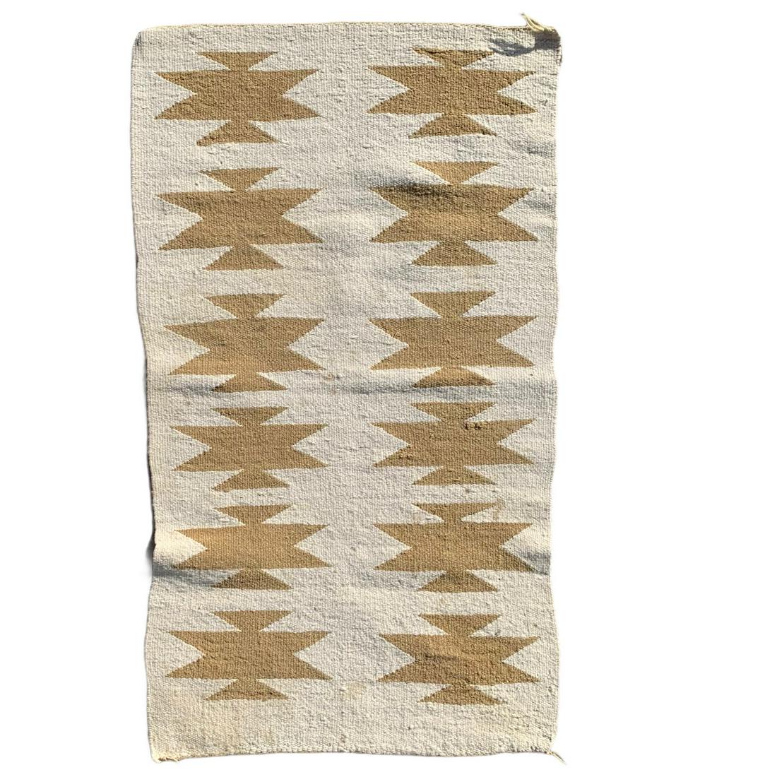 Navajo Regional Rug: A Navaho hand woven Navajo Regional Rug bought on a trip to California on the train. They were woven by the Navajo for the Route 66 Tourist and Fred Harvey Shops along the A.T.&S.F. Atchison Topeka & 