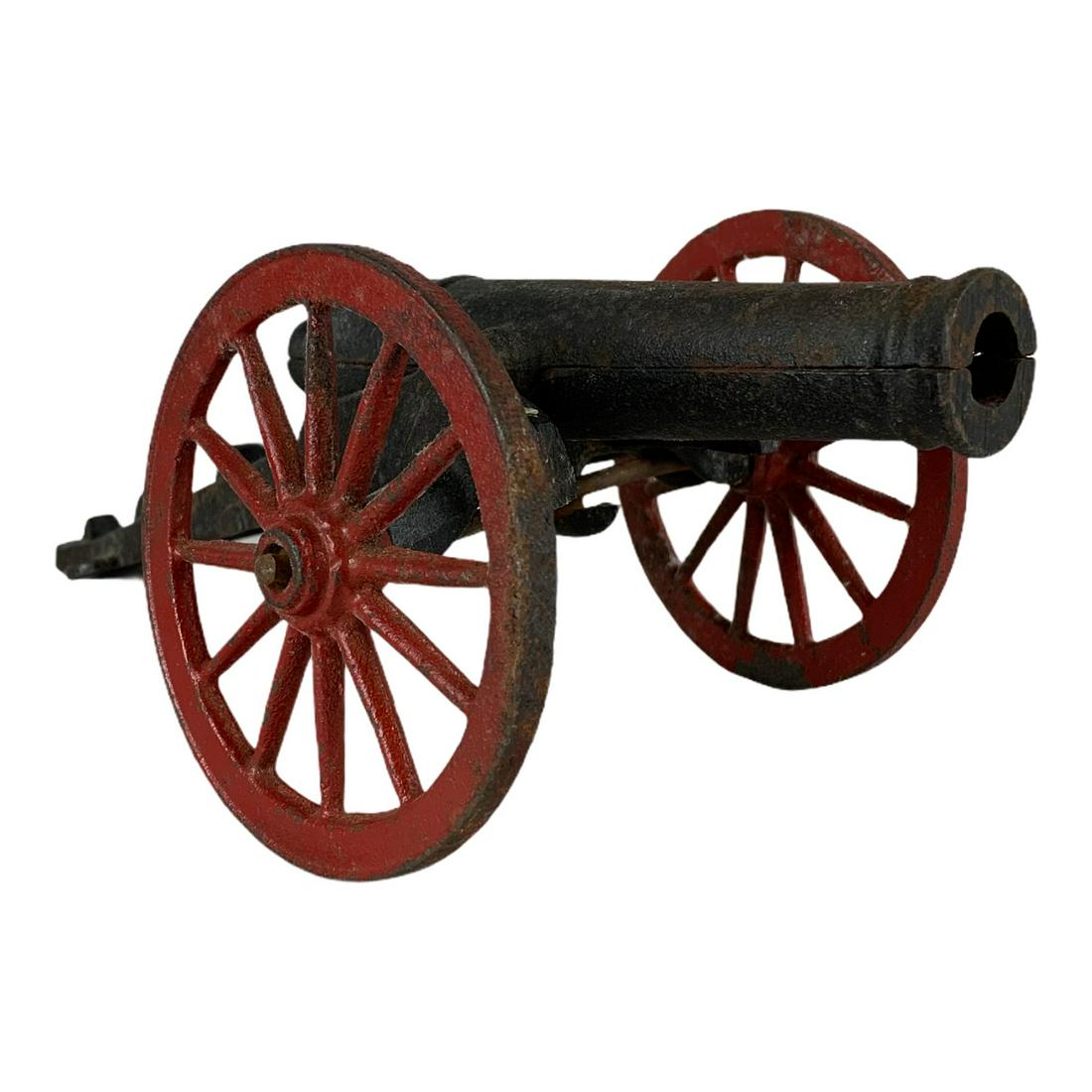 Cast Iron Toy Cannon: A cast iron toy cannon, marked JW under carriage. 10 ½” long, complete