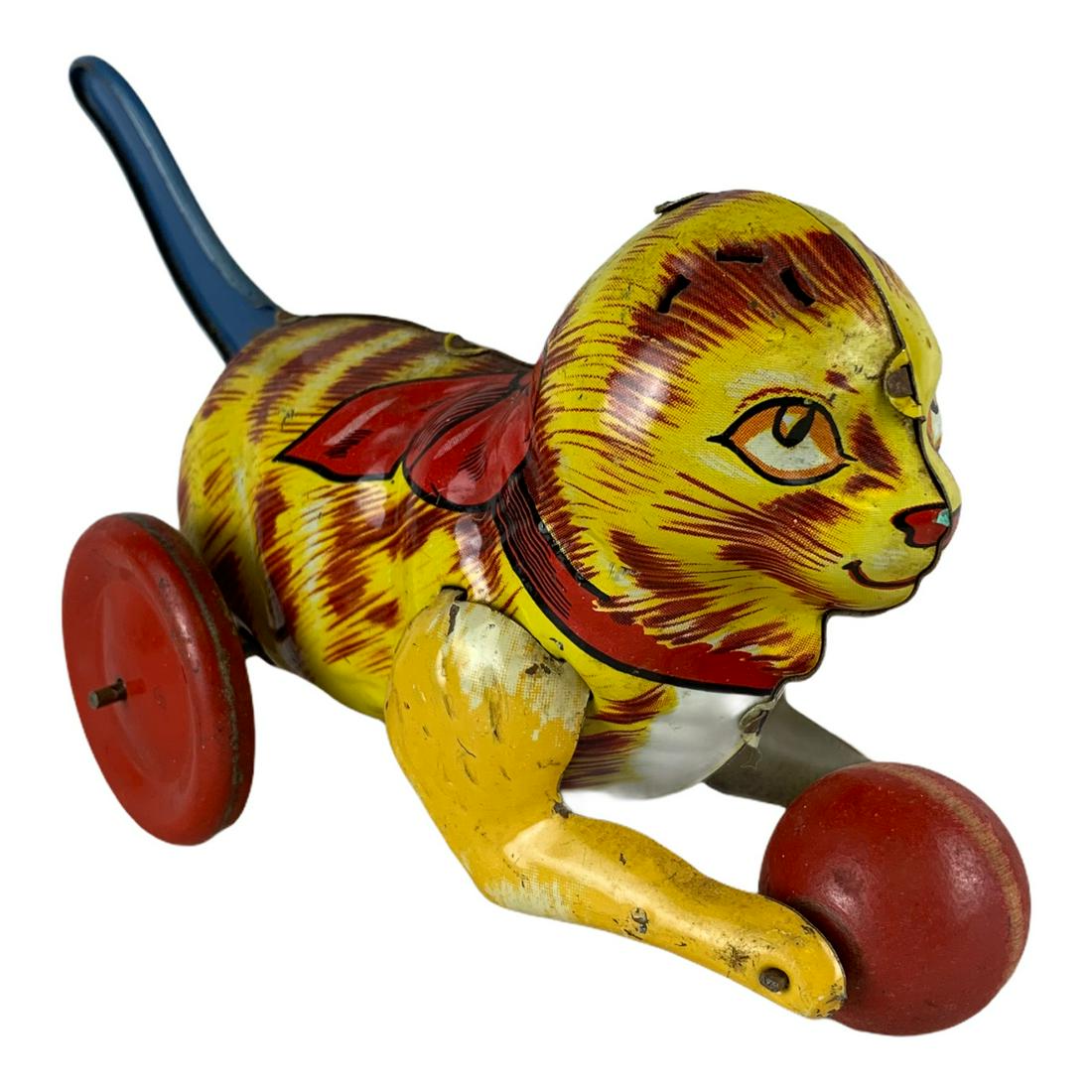 Marx Tin Cat Playing with Ball Toy: A good Marx Cat playing with ball toy. Pull down tail to make it go. Excellent used condition. Strong paint. No damage. 8”