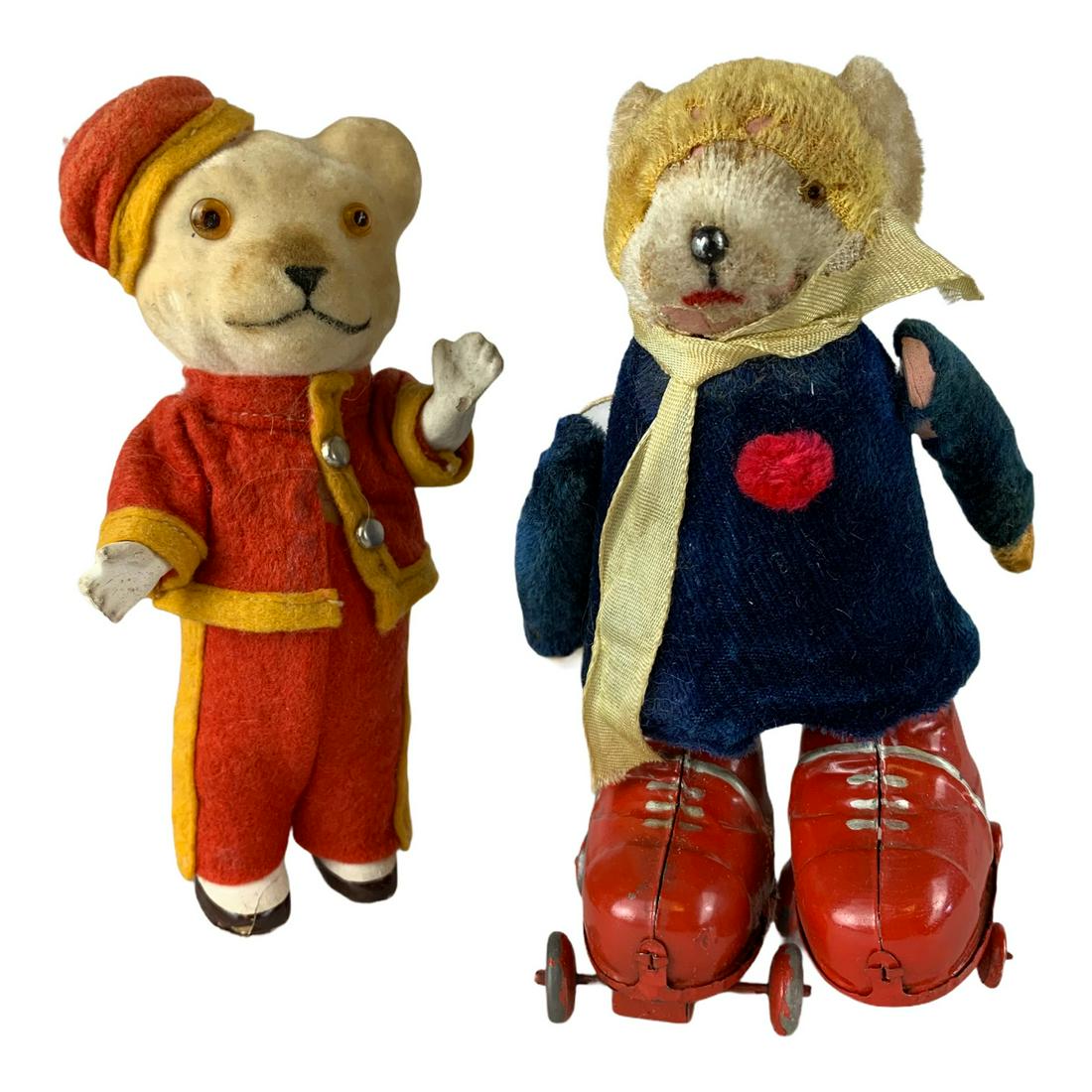 2 Vintage Wind-up Bear Toys: A neat pair of vintage Toy wind-up bears. [1] 6” bear with large tin roller skates. Slight cloth damage on one arm and top of head. [2] 6” bear in porters uniform. Cloth good. Bottom of one shoe m