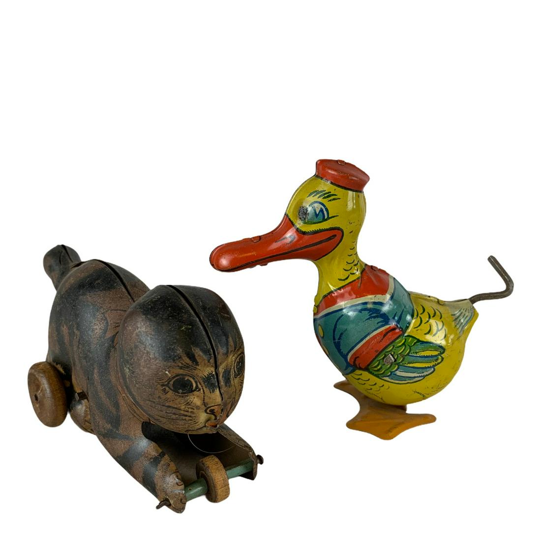 Chein Toy Wind-up Duck and Tin Wind-up Cat with Ball: 2 wind-up toys [1] J. Chein & Co. Tin wind-up duck with key and works fine,great paint 4”, [2] Tin wind-up cat with ball 5”, missing wind-up tail, as is.