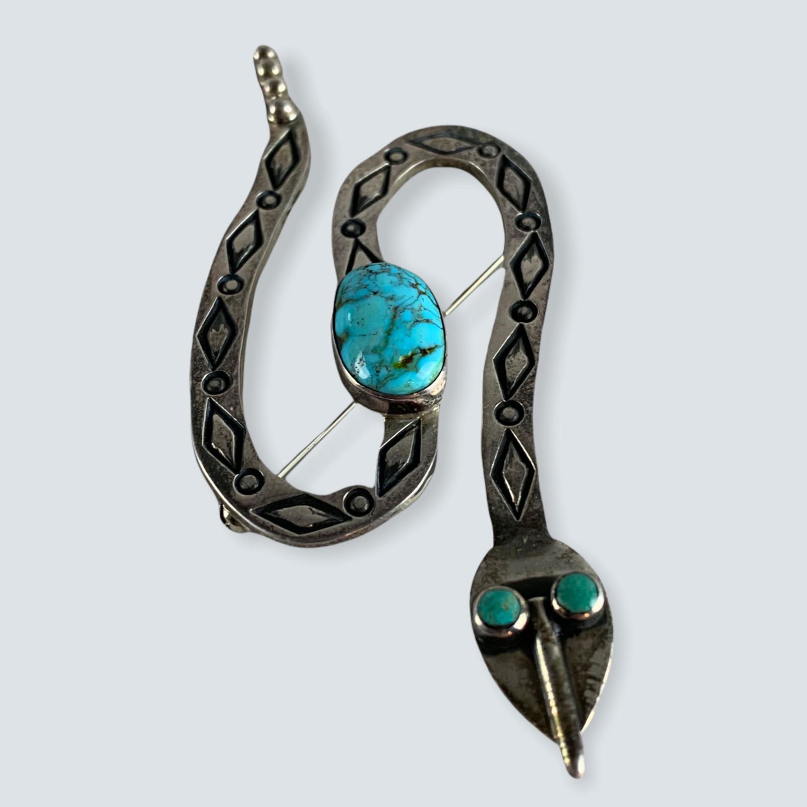 Unique Navajo Snake Pin: Unique Navajo Snake pin with diamondback stamping and turquoise stones. 2 x 3. Late 1900â€™s
