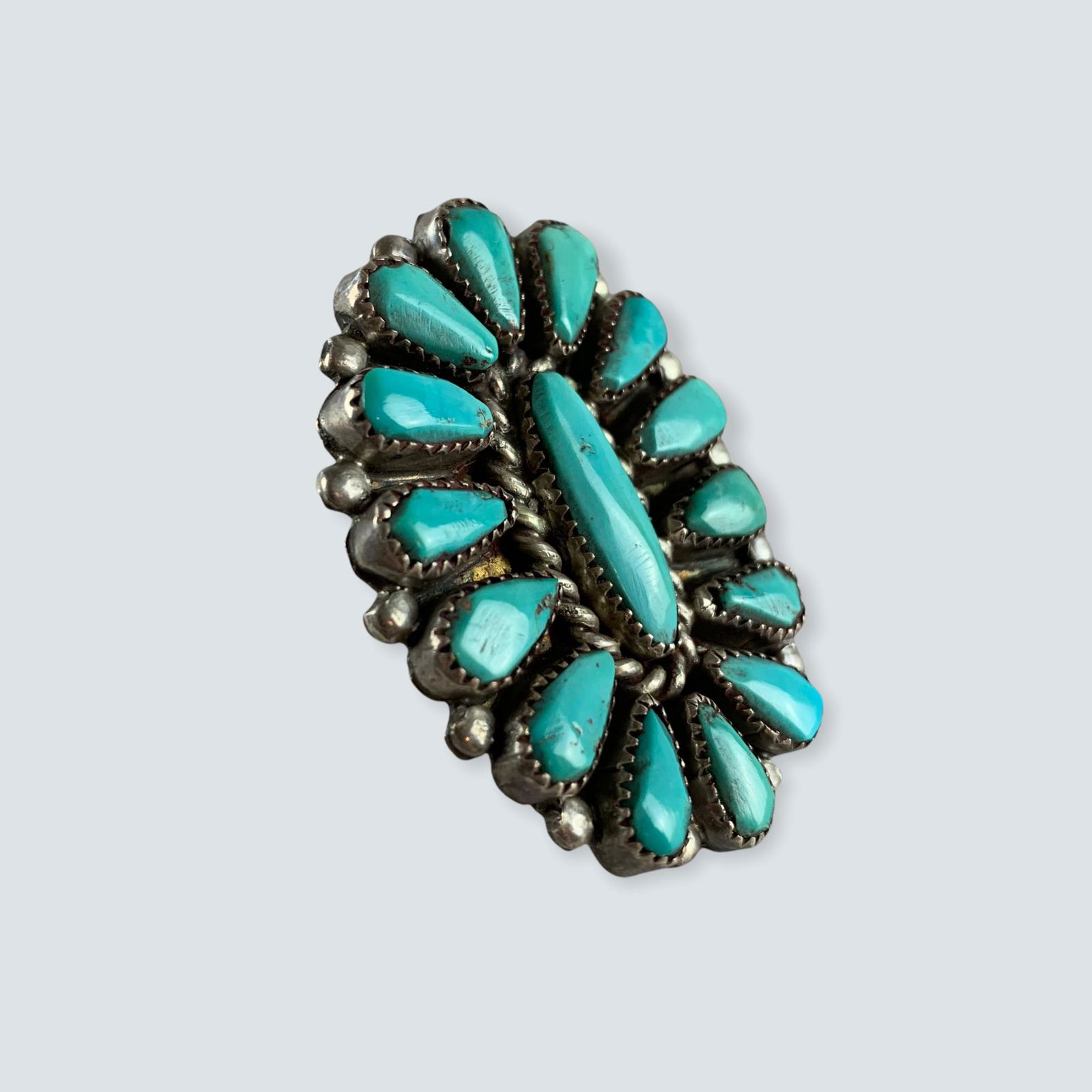 Large Zuni Ring: Size 8 Zuni teardrop cluster ring with natural turquoise stones. Late 1900â€™s