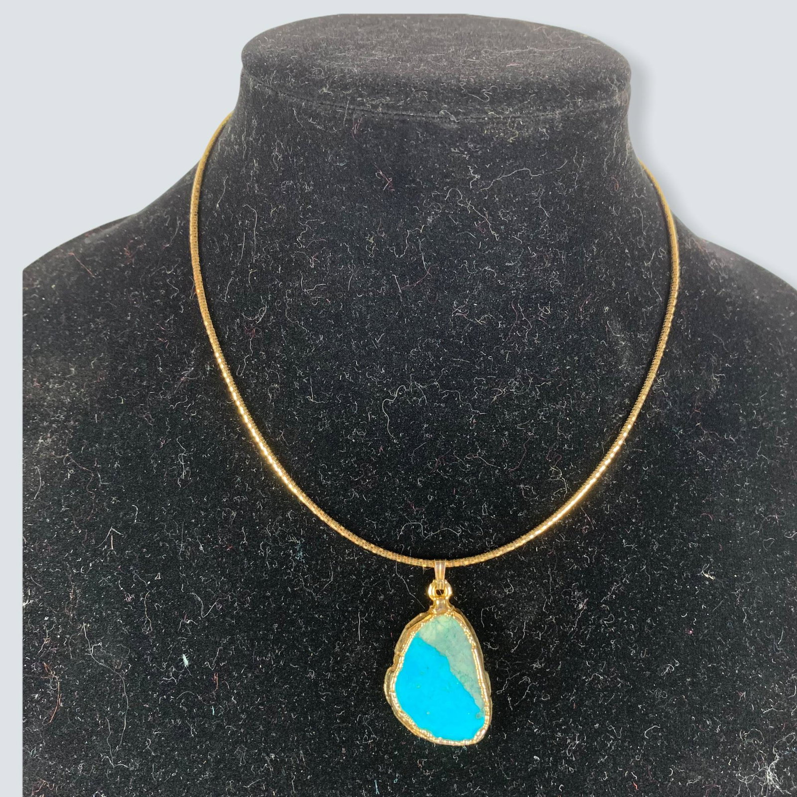 Gold Necklace: Elegant 14K gold braided choker necklace with turquoise pendant mounted in 14k. Contemporary