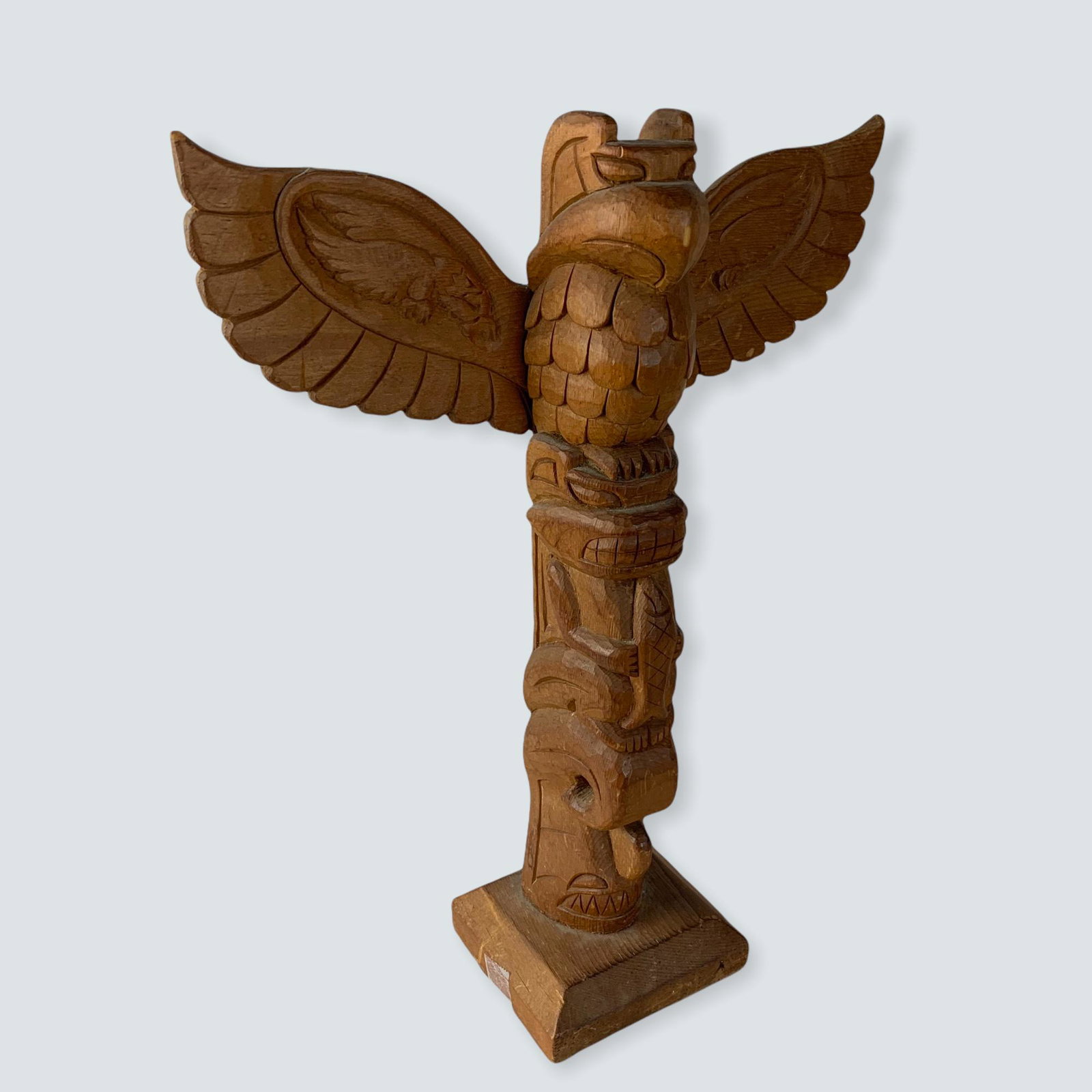 Carved Totem by M. McKay: A signed 12 totem pole carved by M. McKay.