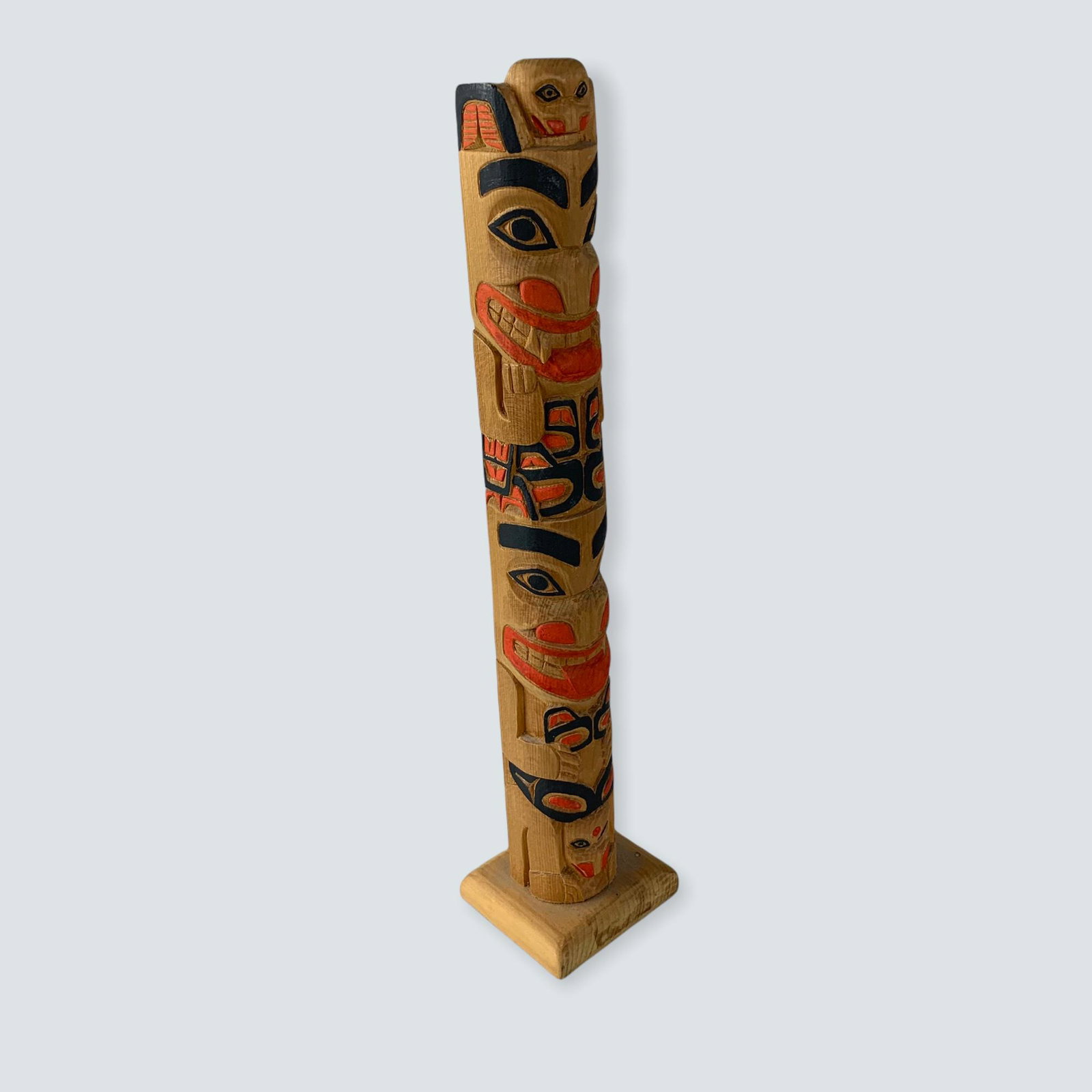 Carved Totem by Leon Ridley: A signed 12 totem pole carved by Leon Ridley, circa 1990. Good