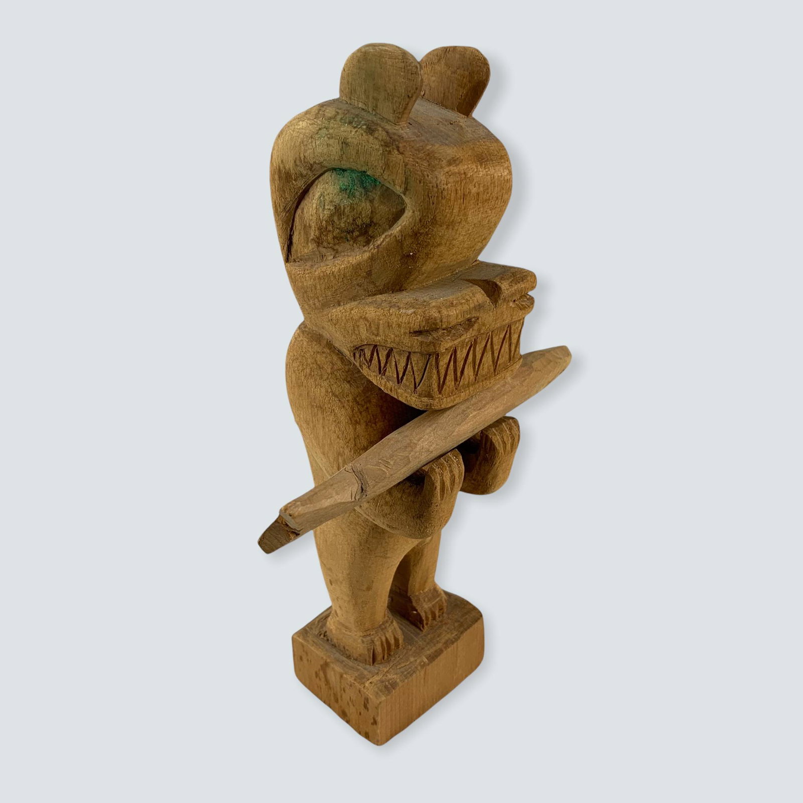 Carved Totem by James Natrall: An 8 carved totem pole, figure holding fish carved by James Natrall, clean & good.